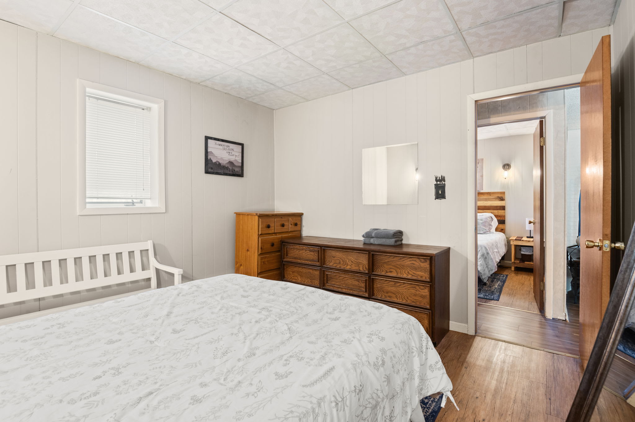 Wake up refreshed in this bright bedroom with plush bedding and mountain charm