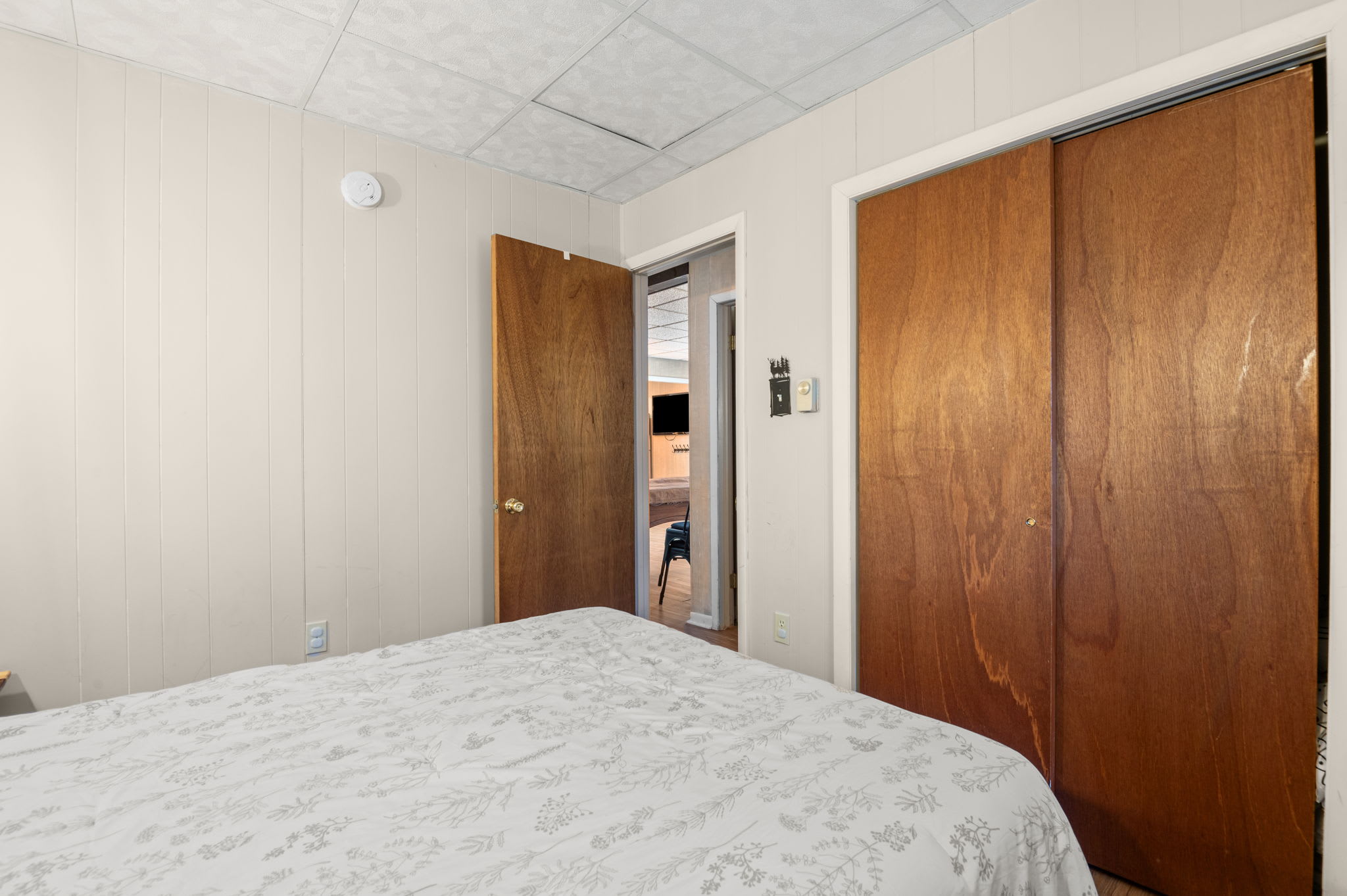 Spacious bedroom with ample storage and soft natural lighting for your comfort