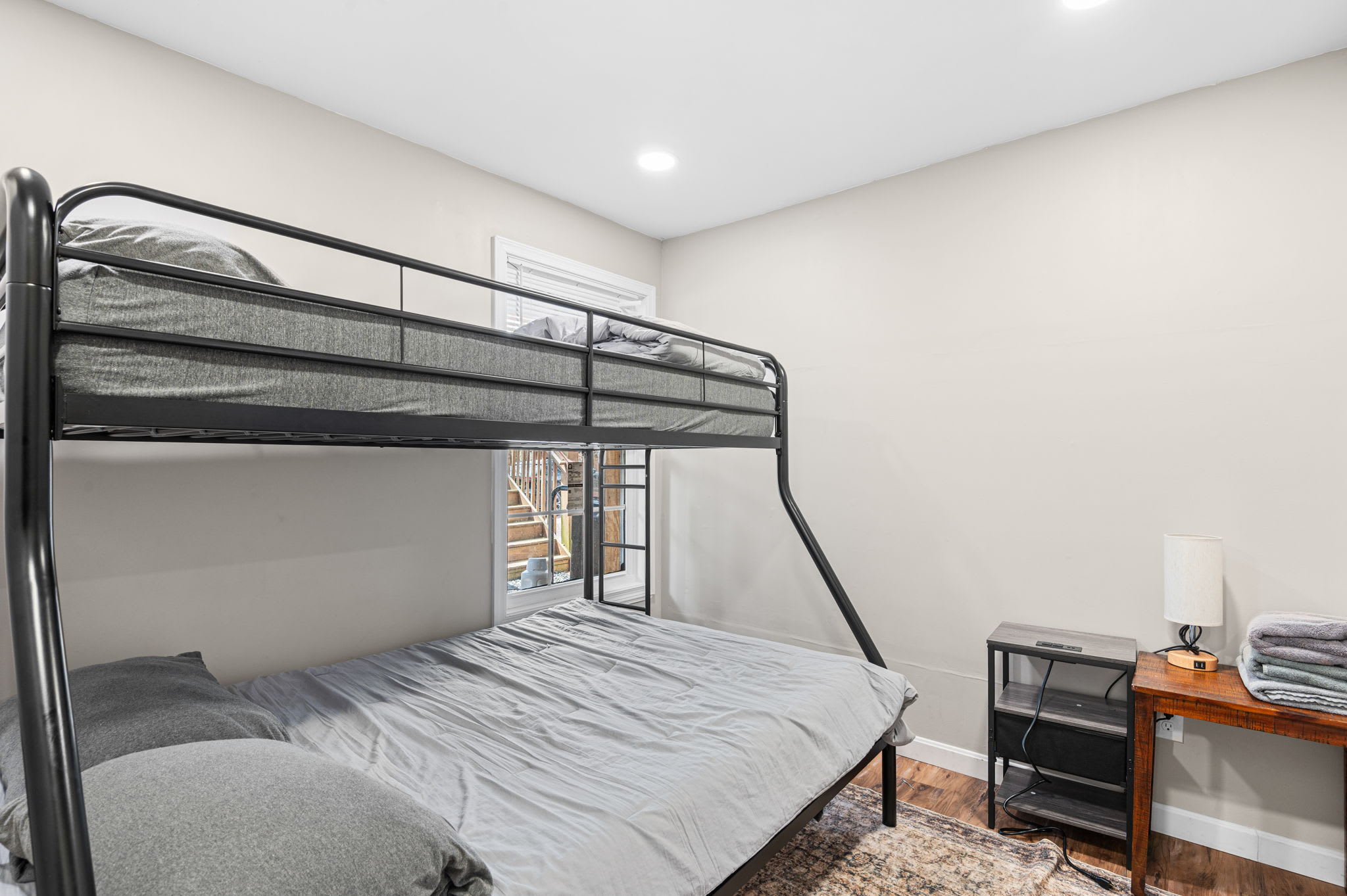 Spacious bunk room with natural light ideal for groups or family vacations