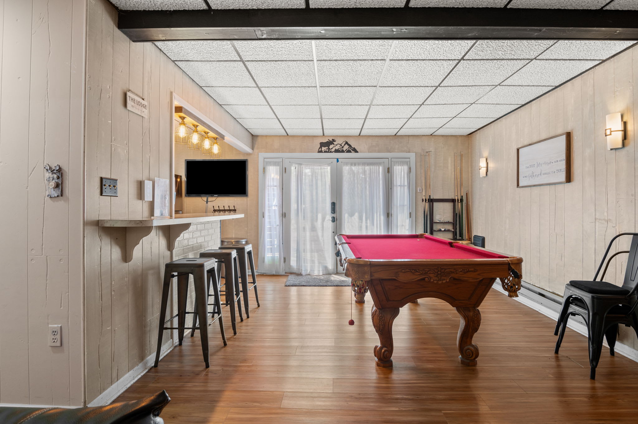 The game room offers pool, a bar, and plenty of space to hang out