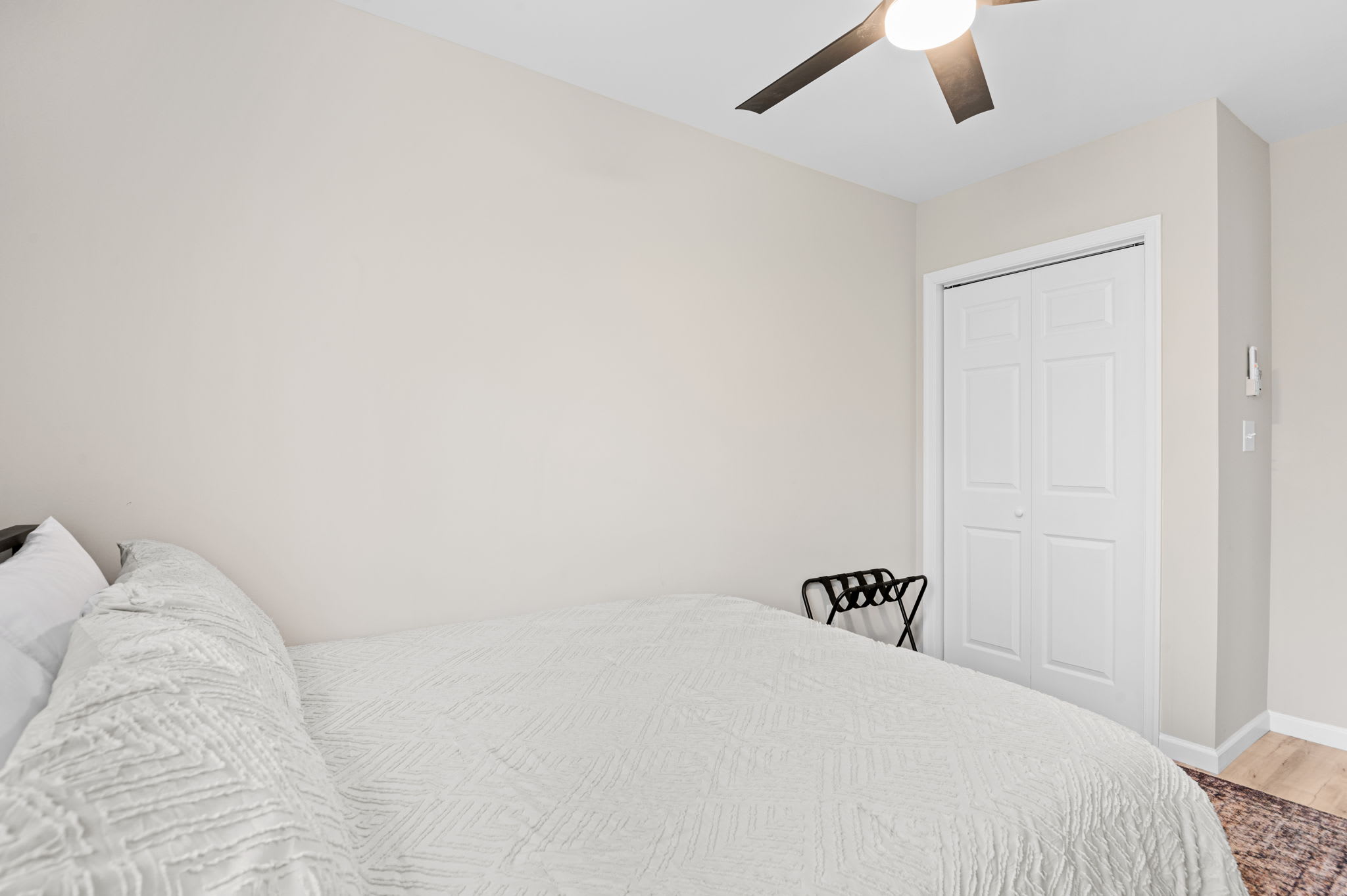Tranquil bedroom retreat with crisp white bedding and warm natural light