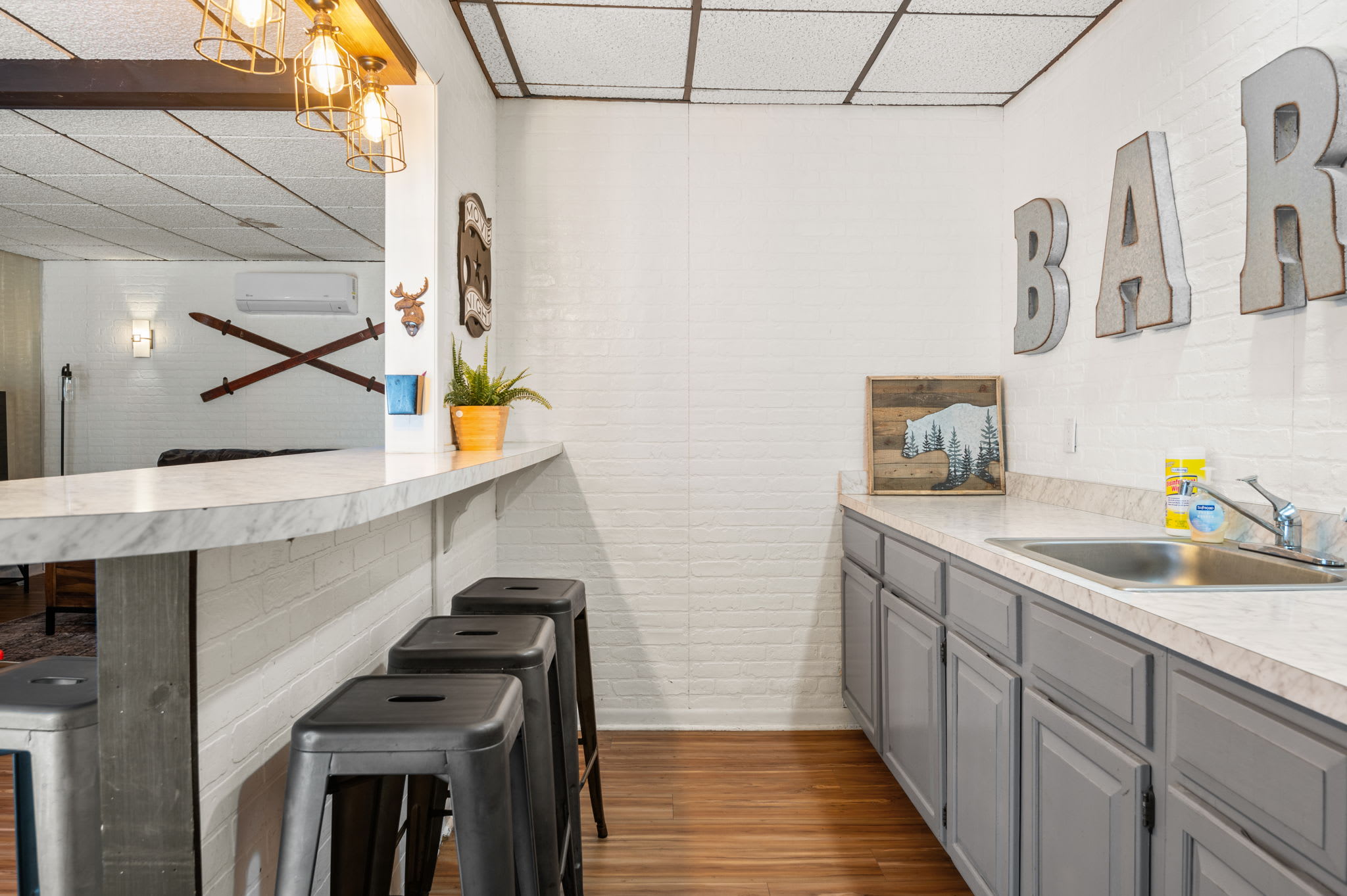 Full bar setup with sink and storage for all your favorite beverages