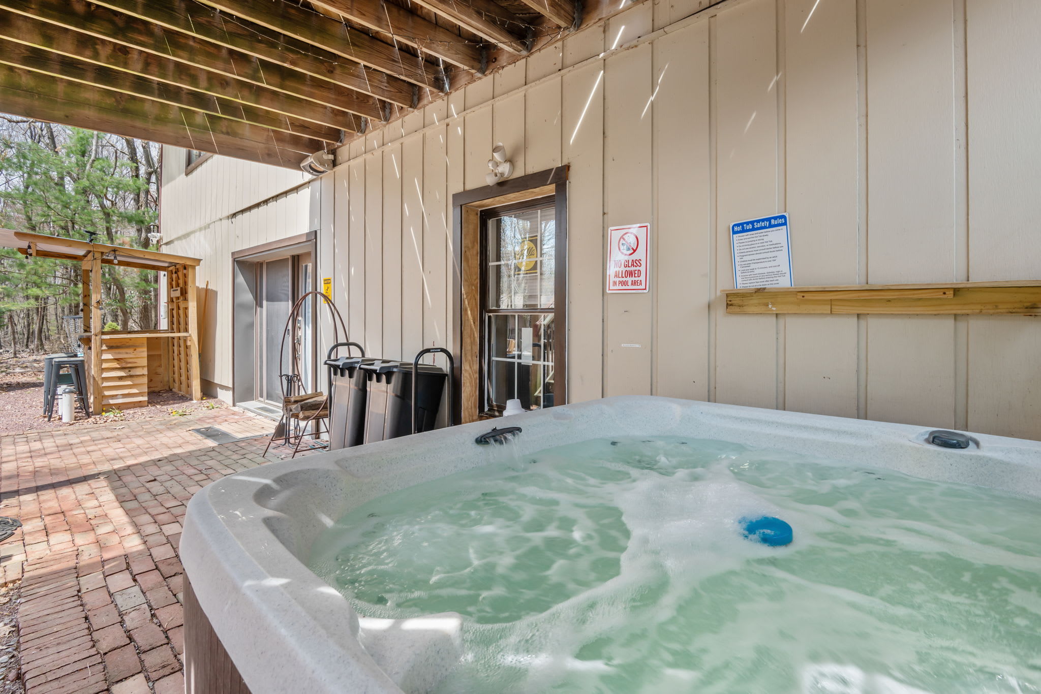 Soak under the stars in the covered hot tub after a day of exploring
