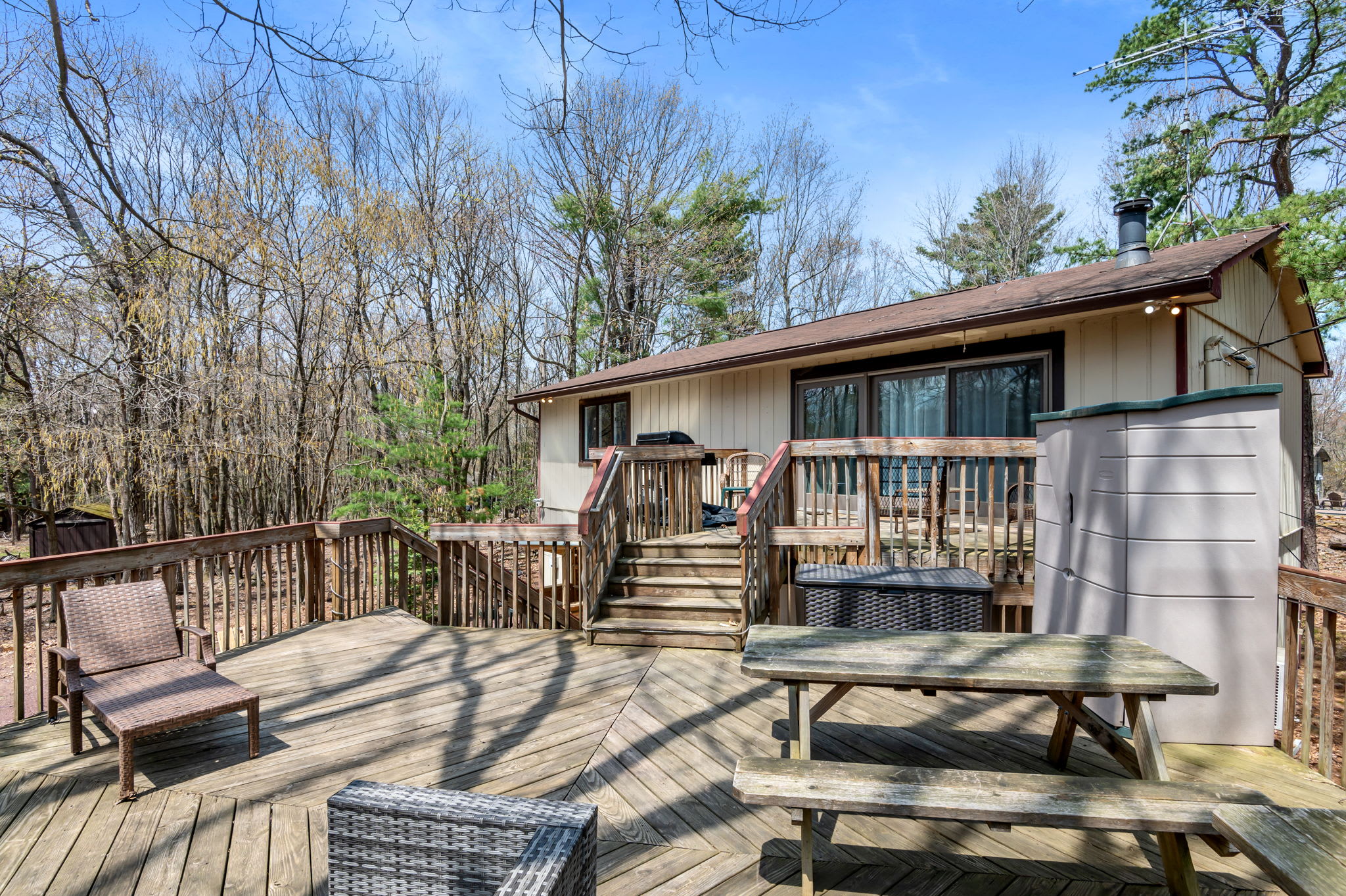 Relax on multiple deck levels with views of the private wooded backyard