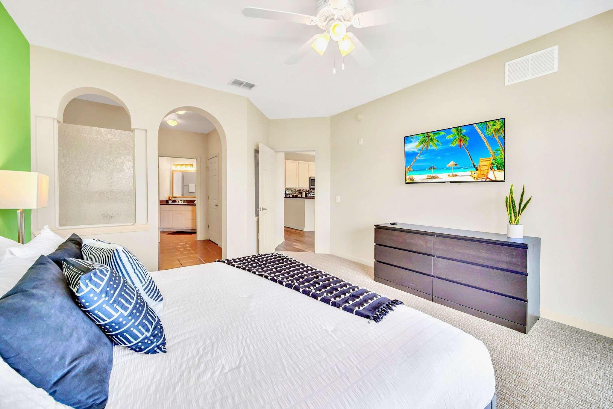 King bedroom with smart TV and en-suite bathroom