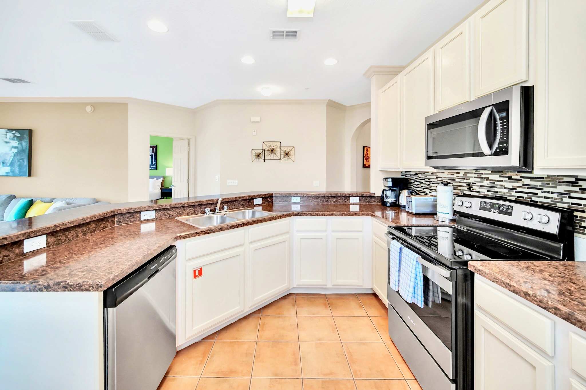 Fully equipped kitchen with silver appliances