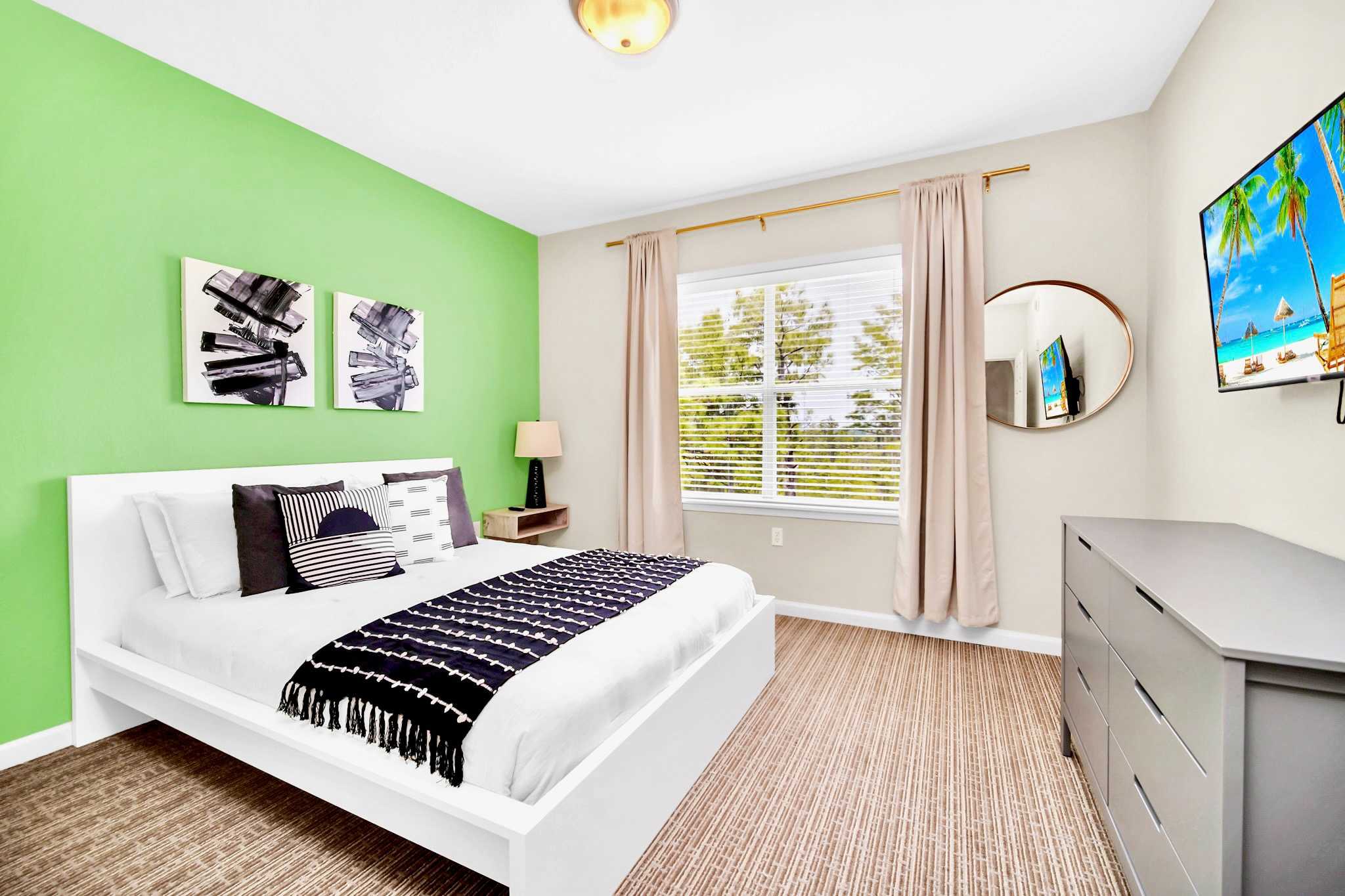 Queen bedroom with smart TV