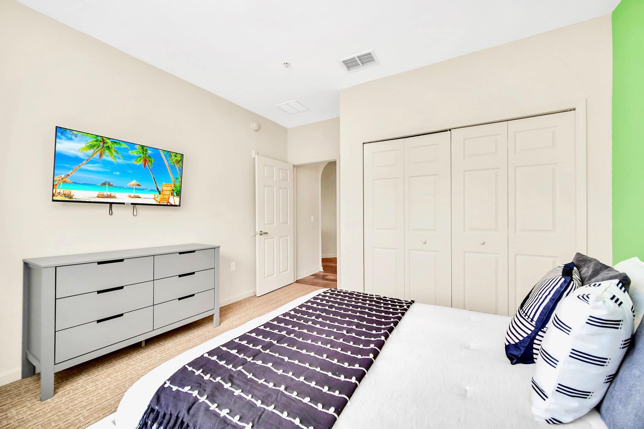 Queen bedroom with smart TV