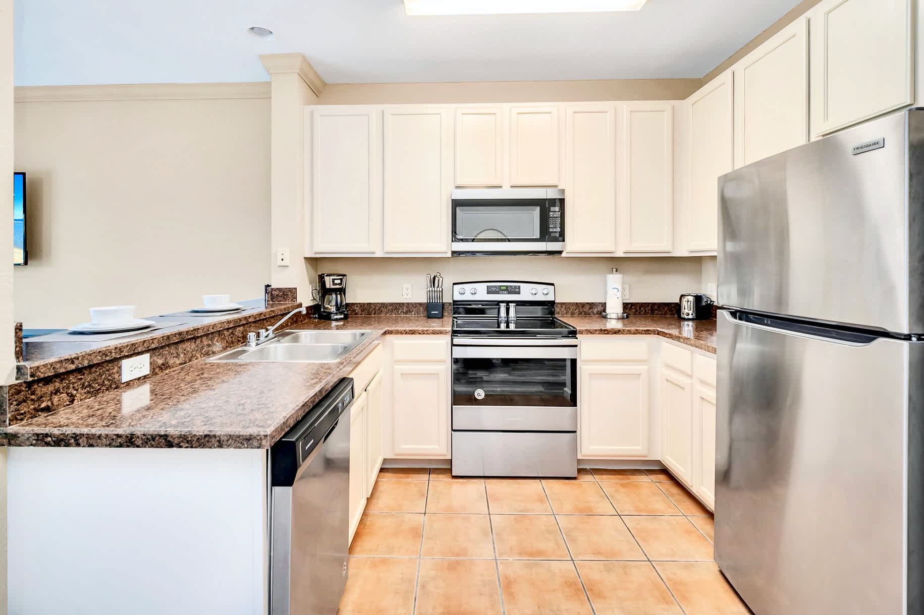 Fully equipped kitchen with silver appliances