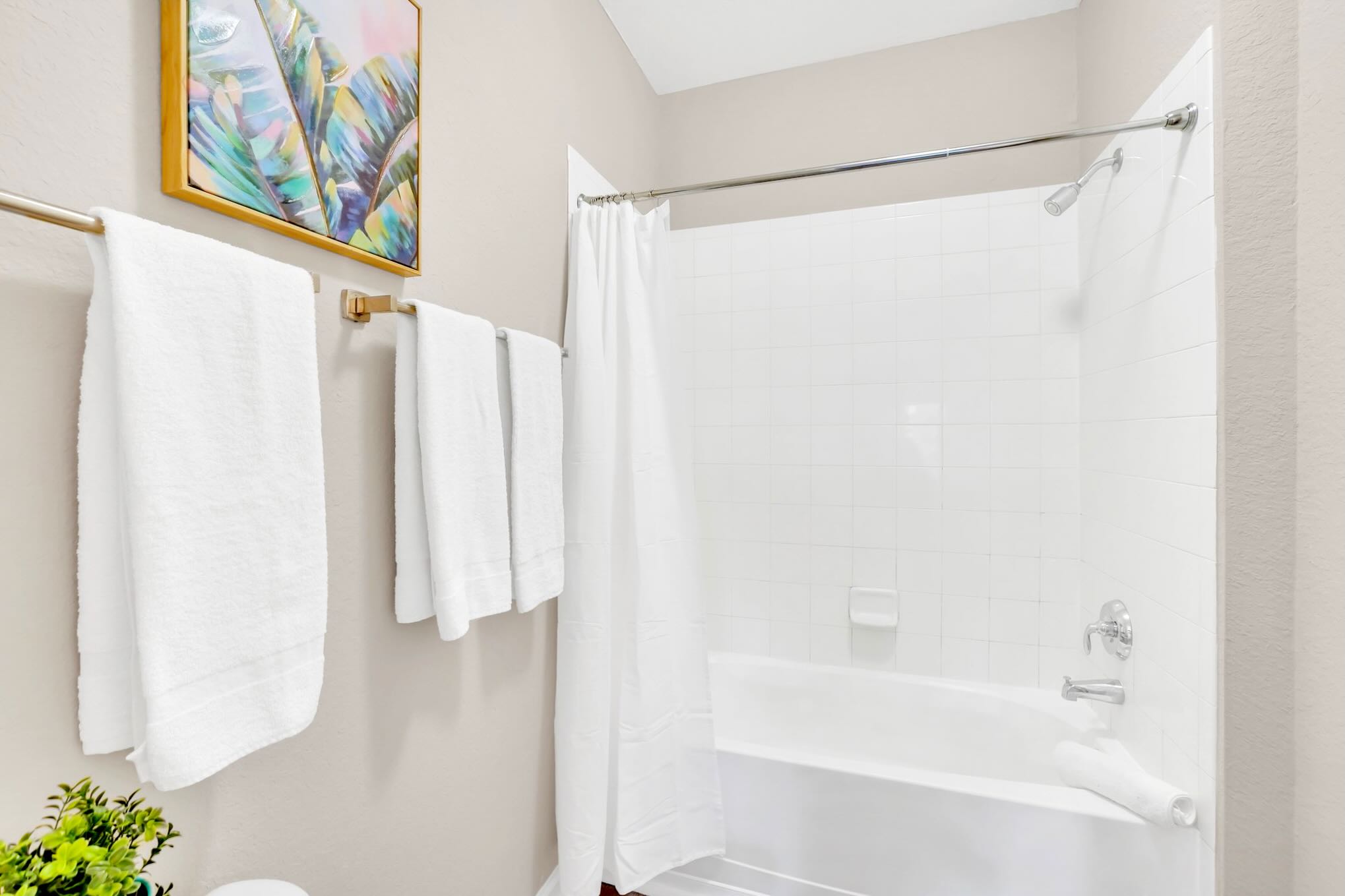 Full bathroom with combined bathtub and shower