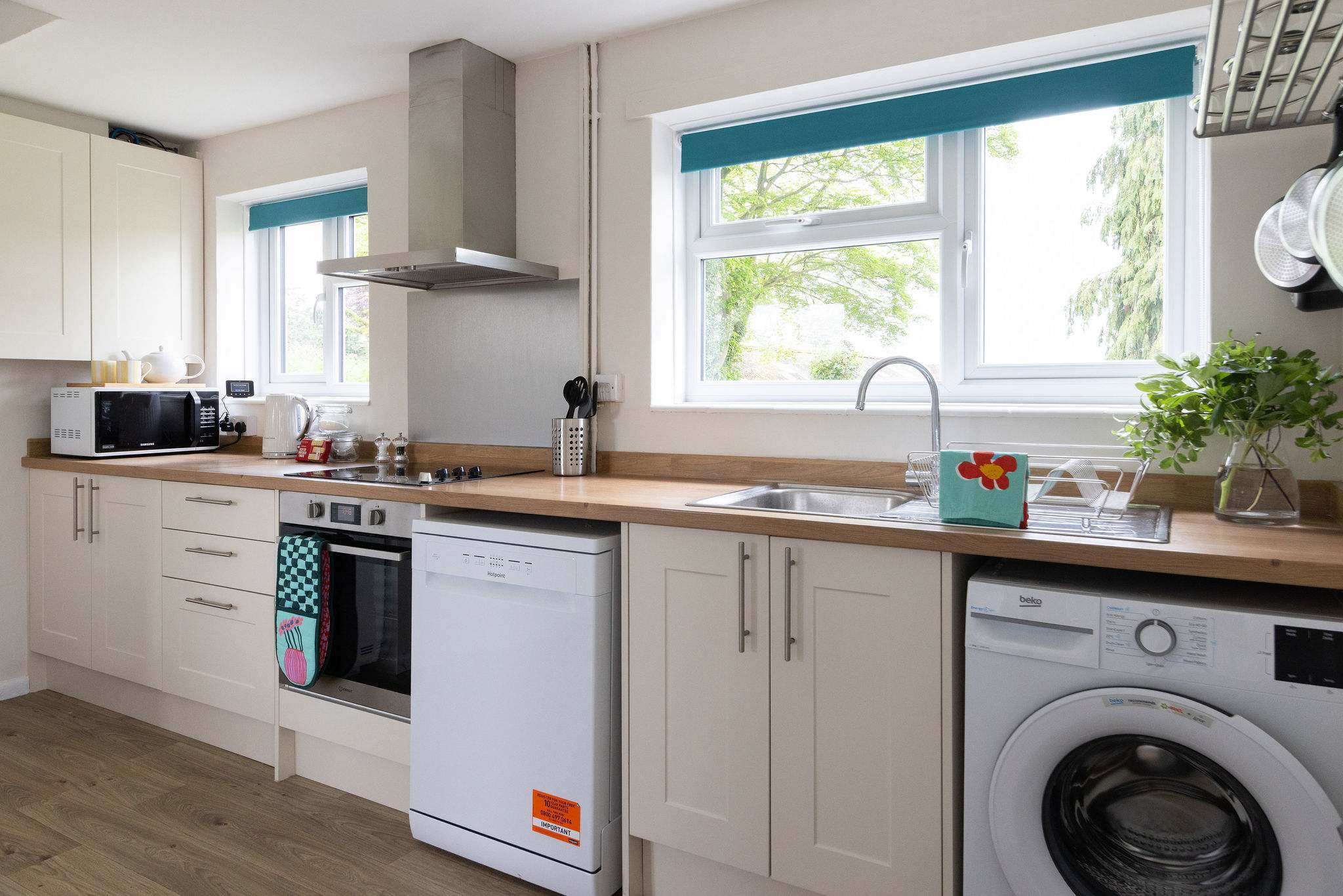 Stunning kitchen features beautiful cabinets and sleek appliances that make cooking a joy.