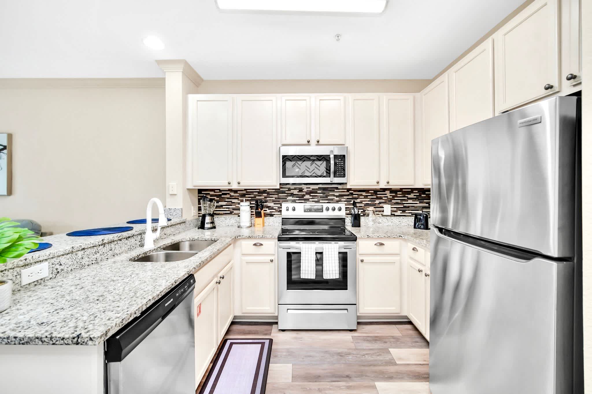 Fully equipped kitchen with silver appliances