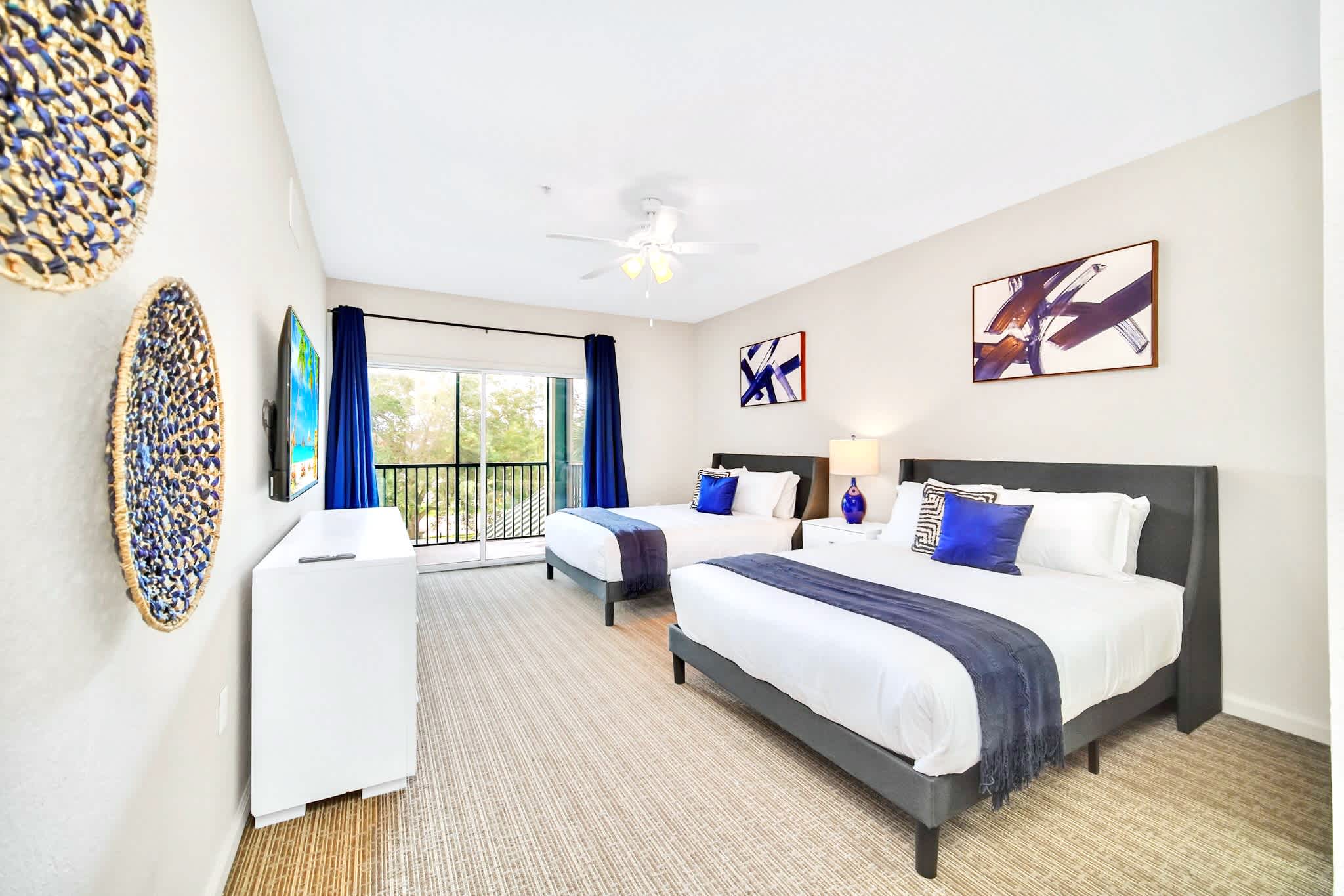 Twin queen bedroom with patio access 