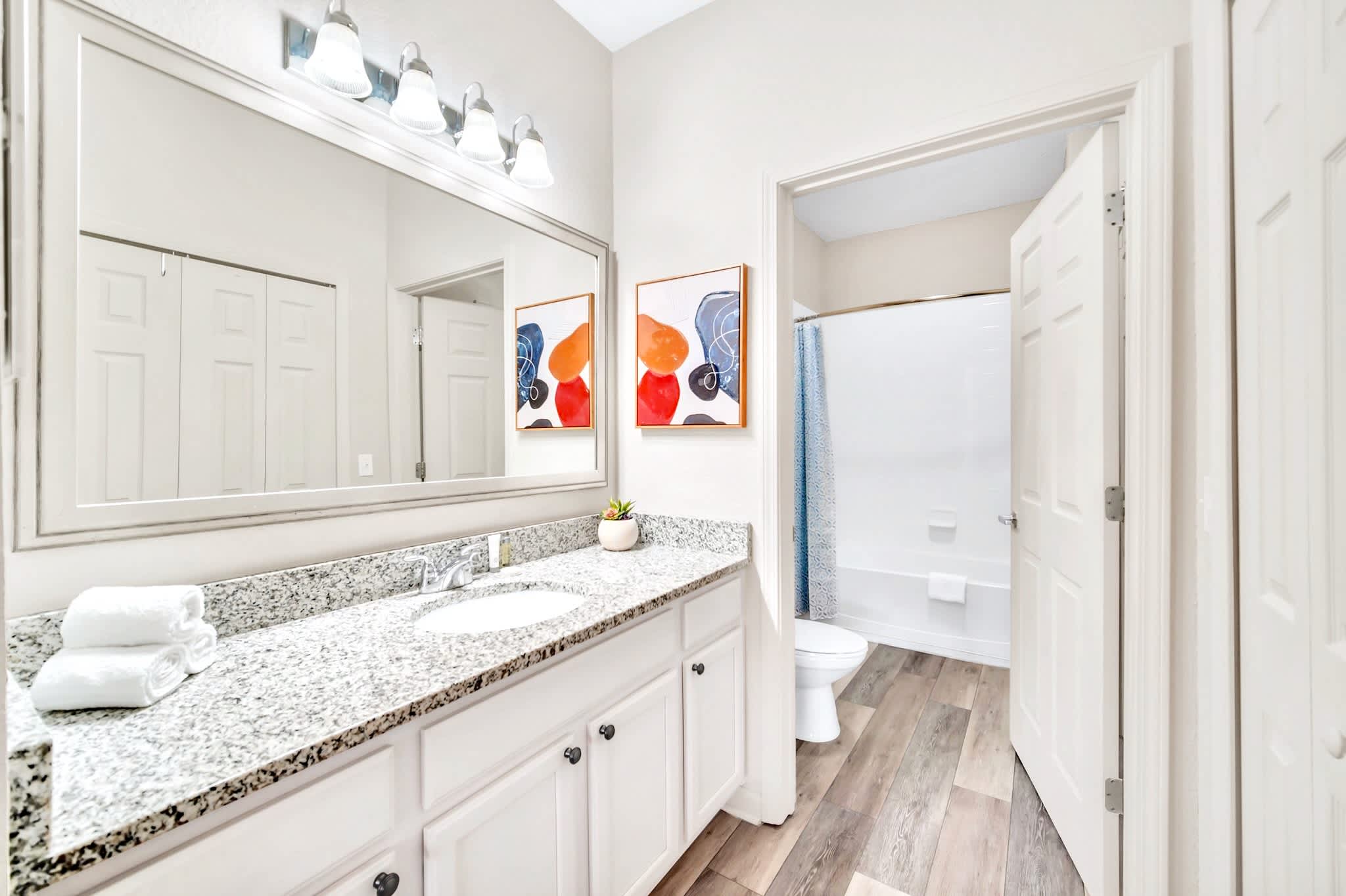 Full modern bathroom with combined bathtub and shower