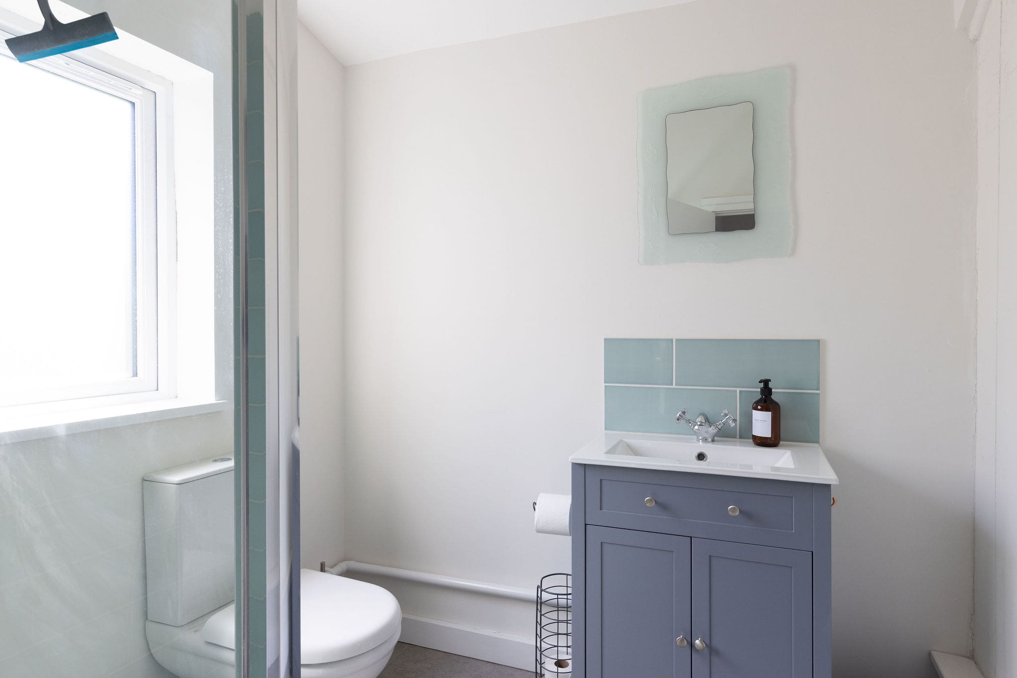 Bright bathroom with walk-in shower