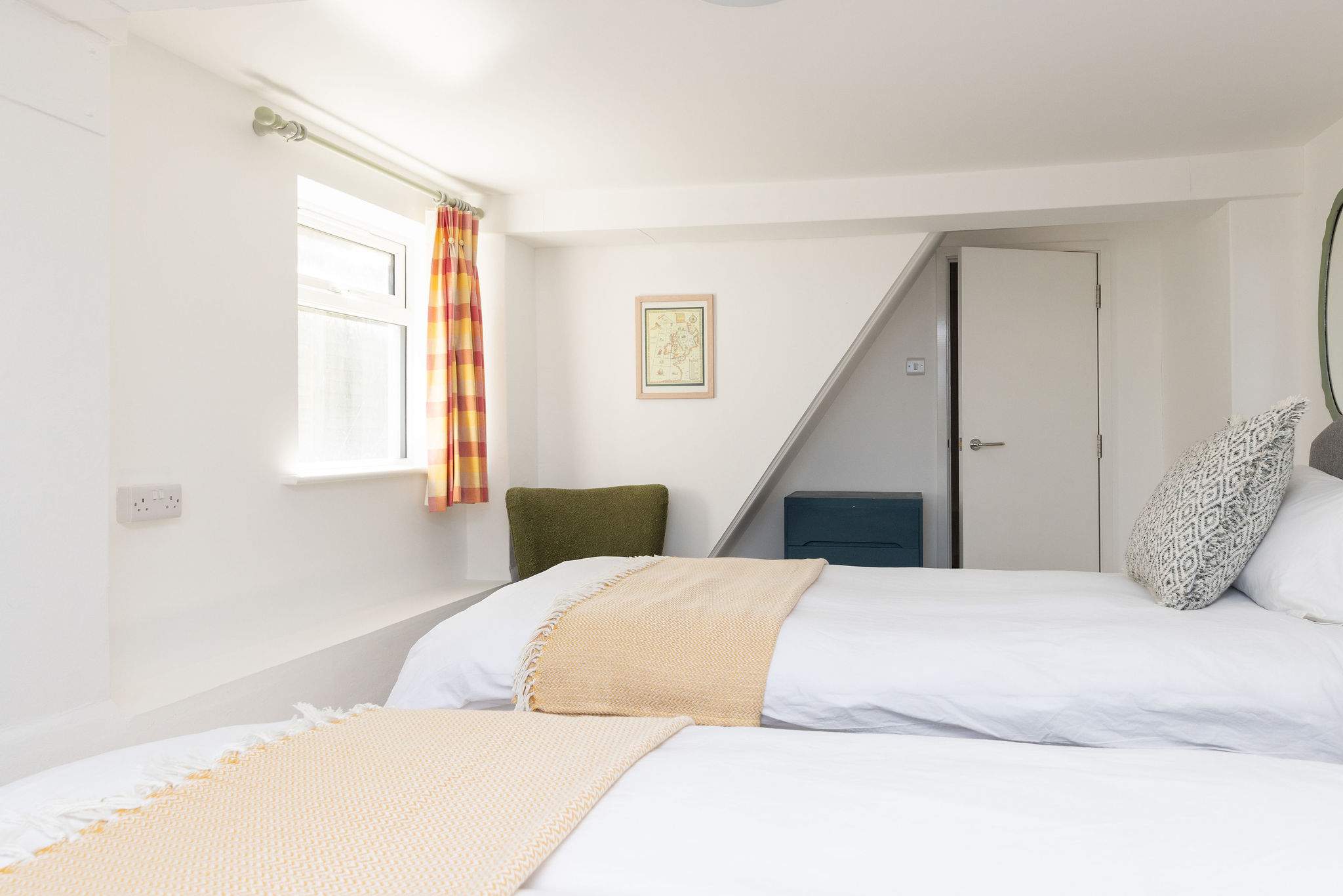 Light-filled room with quirky angles and charm