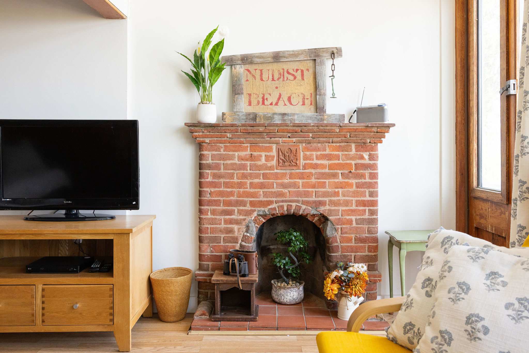 Original fireplace with playful seaside charm