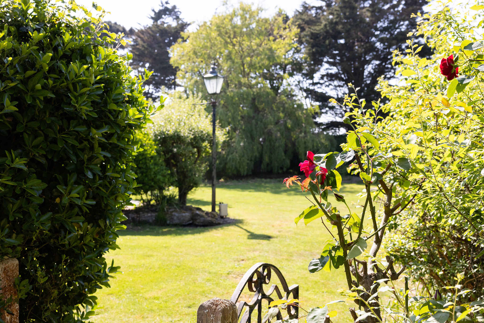 The large well-maintained private garden and expanse of green lawn!