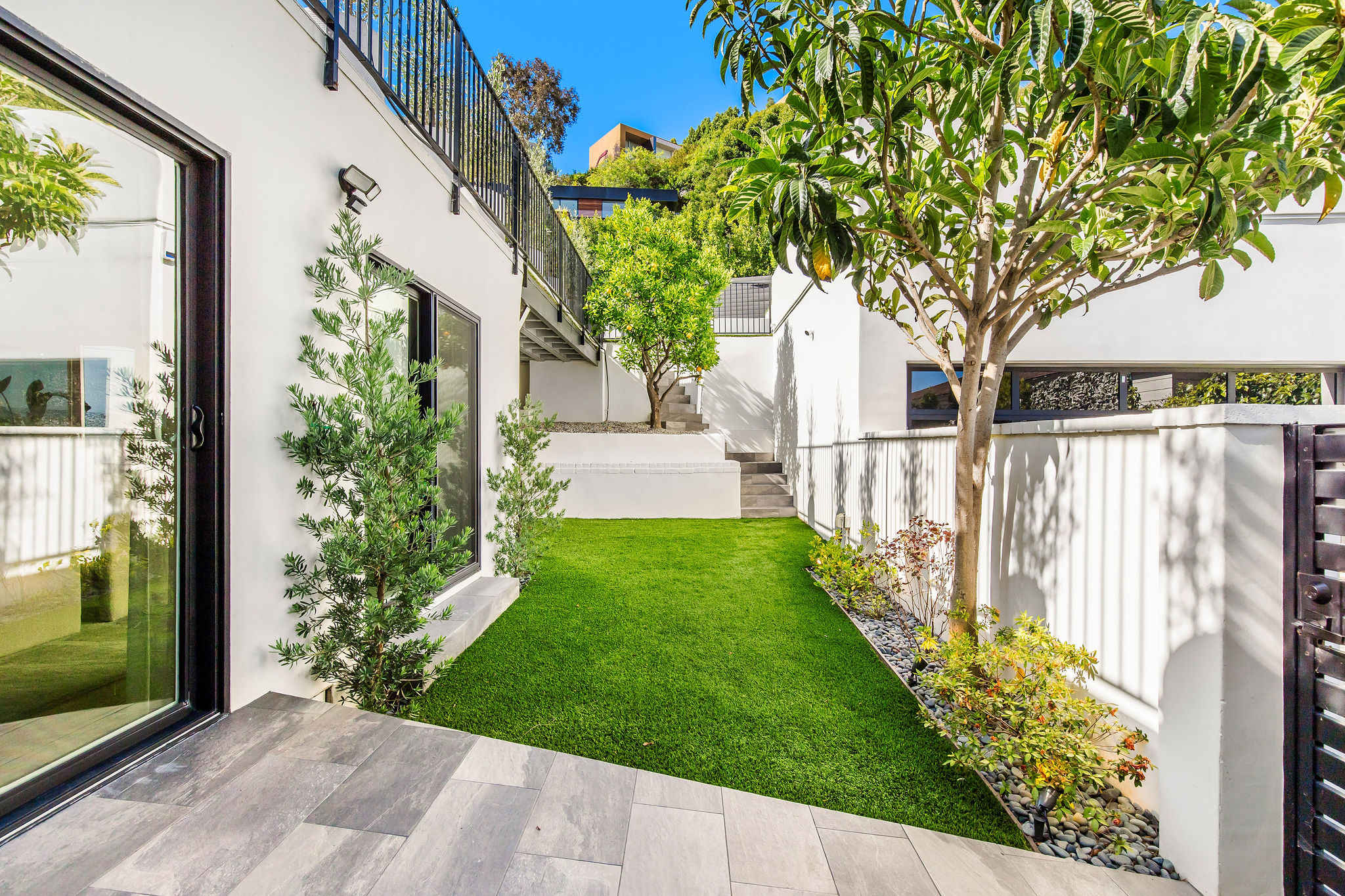 A hidden stretch of lawn for play, peace, or a morning reset