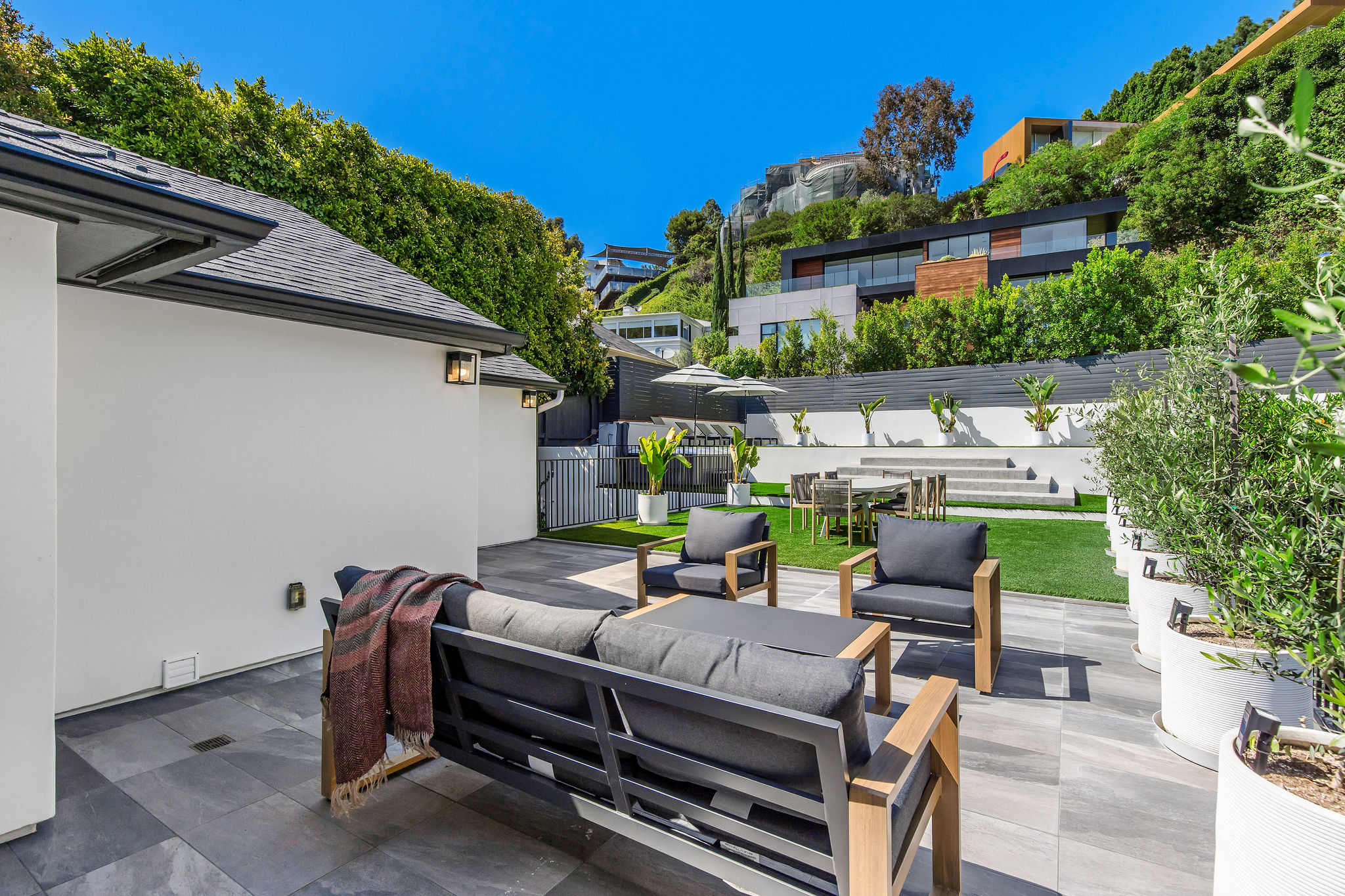Lounge beneath lush hillside views with everything you need steps away.