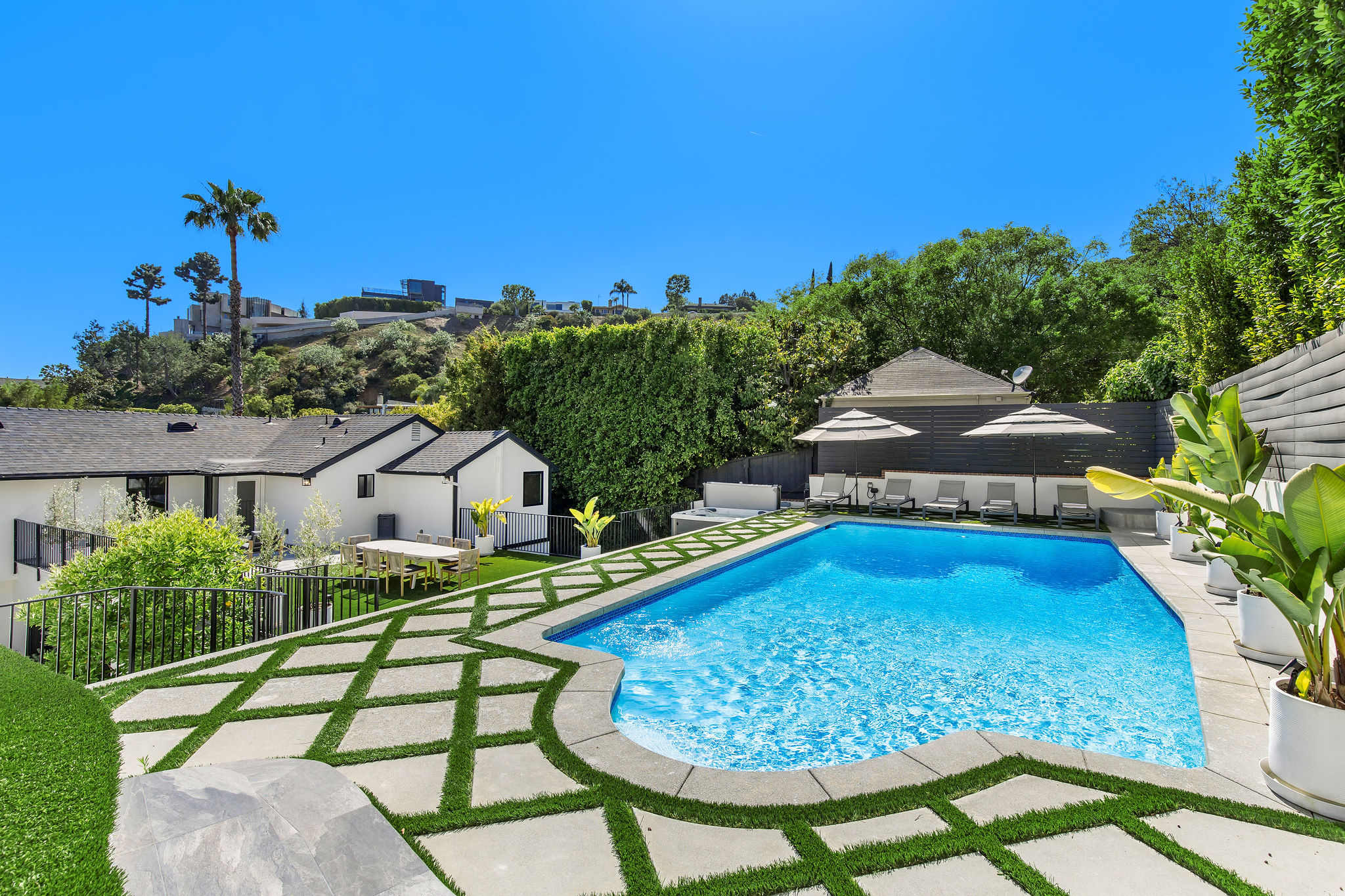 Entertain poolside with space to spread out in style