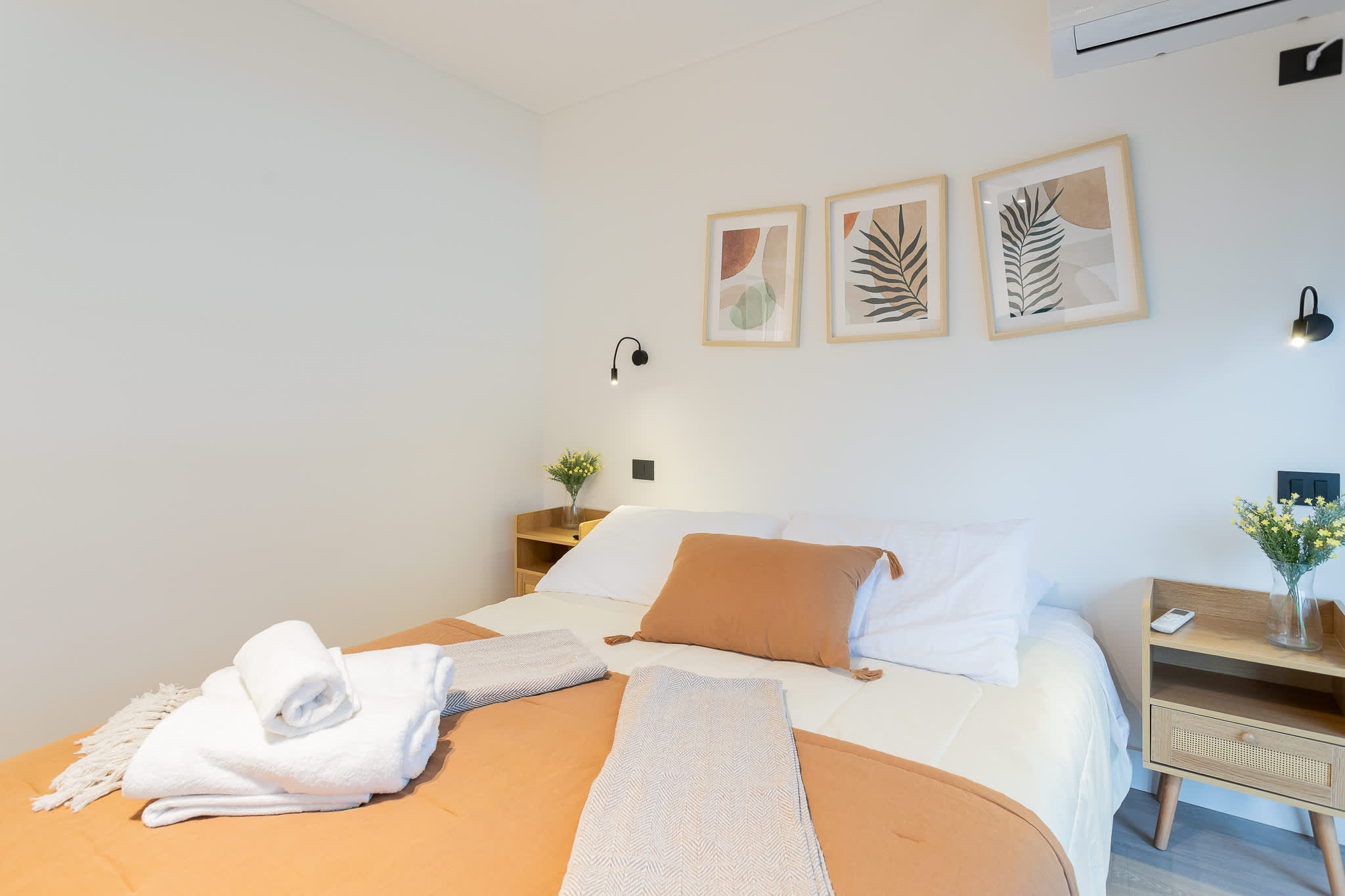 Relax in this serene bedroom with cozy linens, stylish decor, and modern comforts for a perfect night's rest.