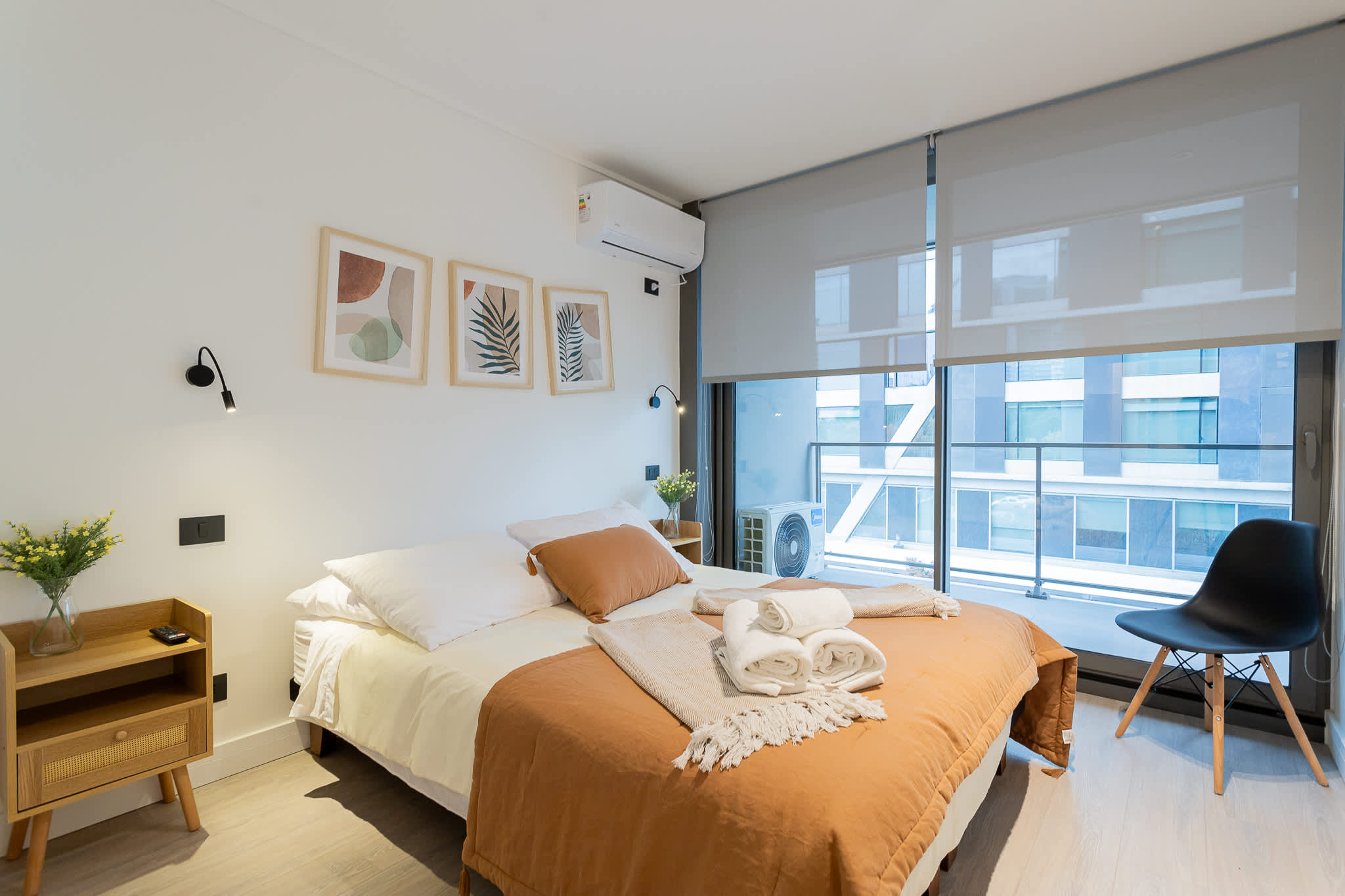 Relax in this stylish bedroom with cozy bedding, modern decor, and a bright, airy ambiance perfect for unwinding after a day of exploring.