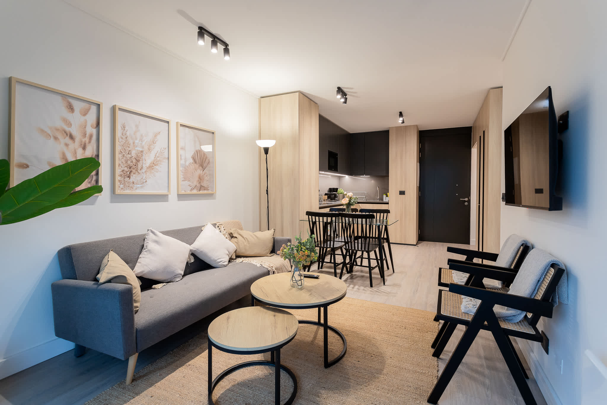 Stylish living space with cozy seating, chic dining area, and modern decor—perfect for relaxation and entertaining.