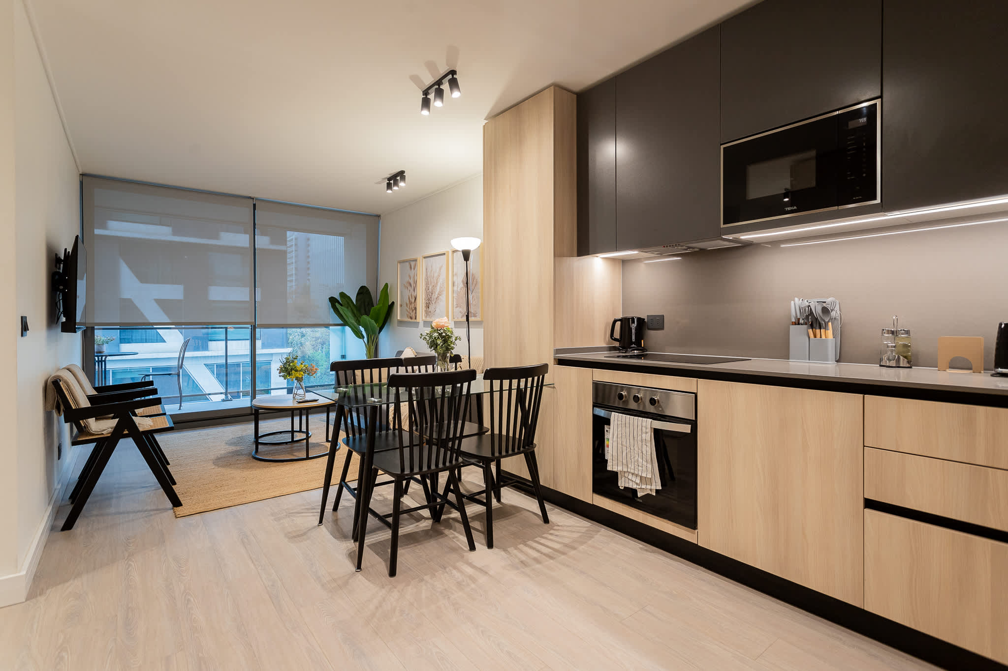 Experience modern elegance in this stylish kitchen and dining area, perfect for cozy meals and gatherings.