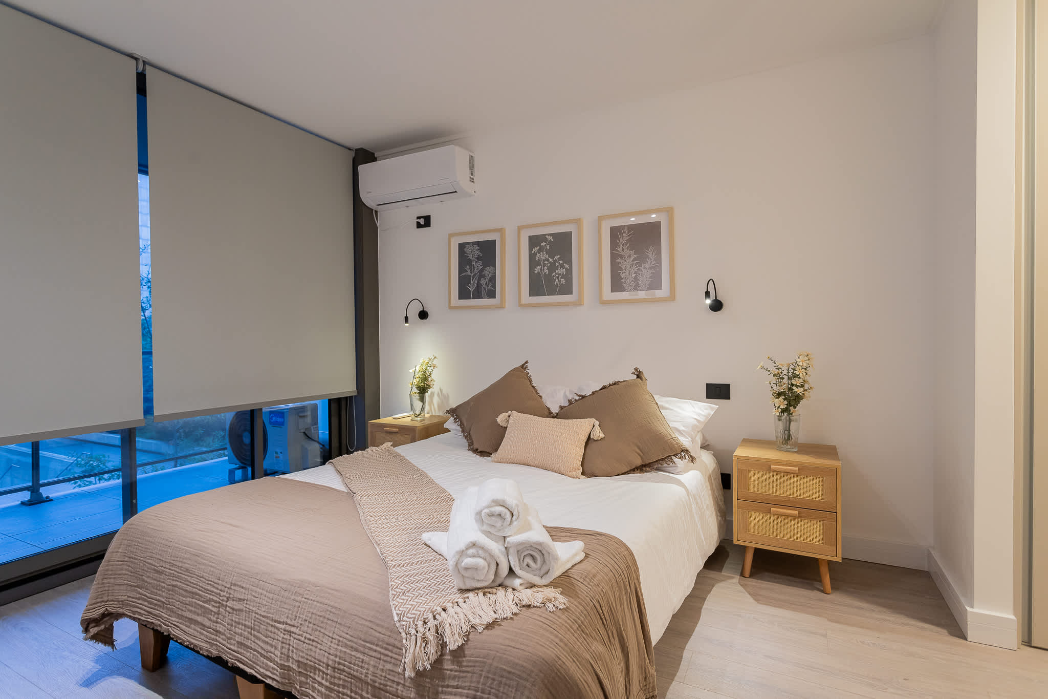 Relax in this serene bedroom with plush bedding, elegant decor, and a calming ambiance perfect for unwinding after a day of exploring.