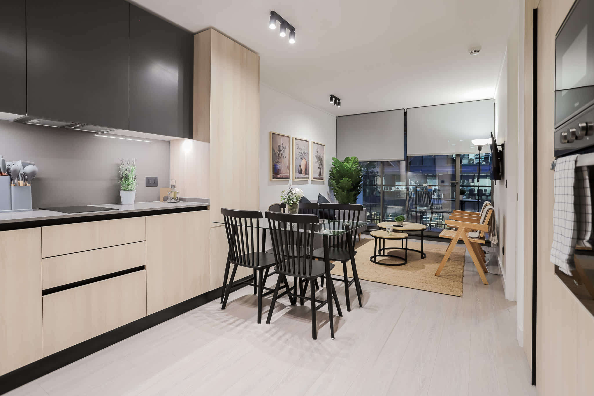 Experience modern elegance in this stylish kitchen and dining area, perfect for cozy dinners and entertaining.