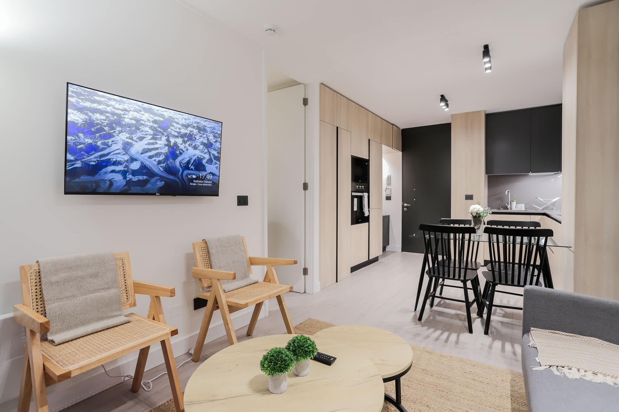 Experience modern comfort in this stylish open-plan living area, perfect for relaxing and dining with ease.