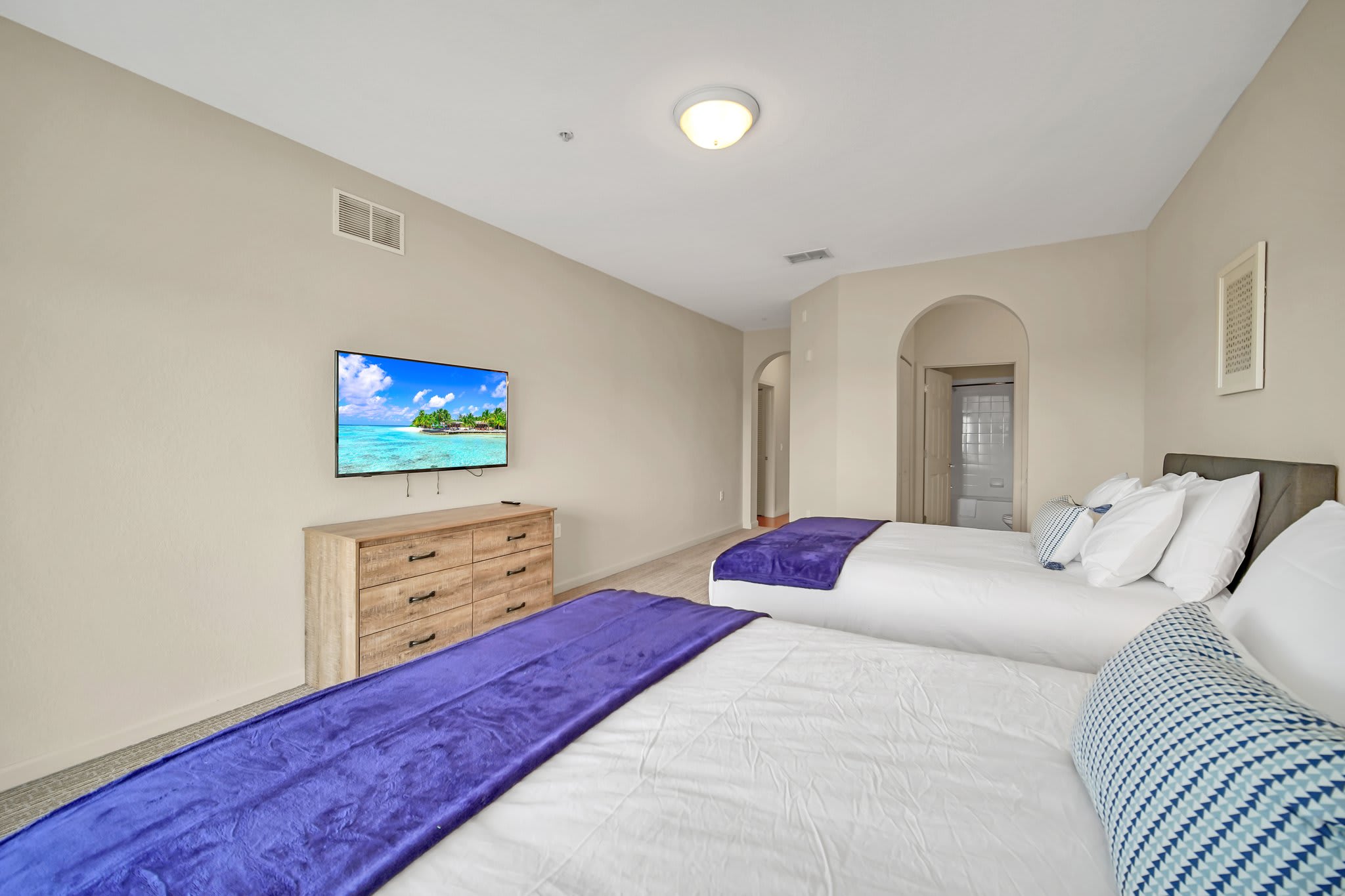 Twin Queen bedroom with en-suite bathroom and smart TV