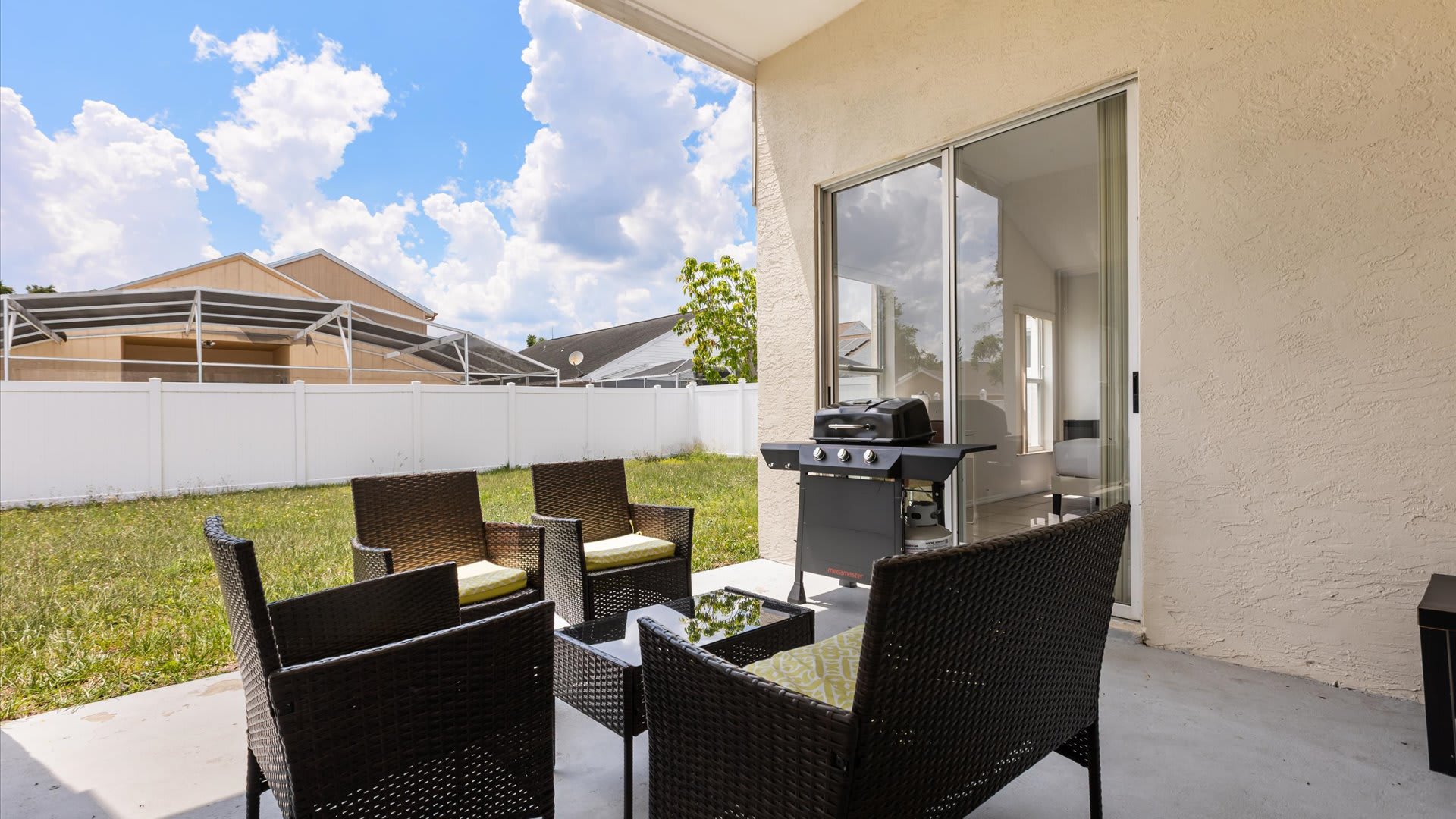 Private furnished outdoor patio with BBQ grill