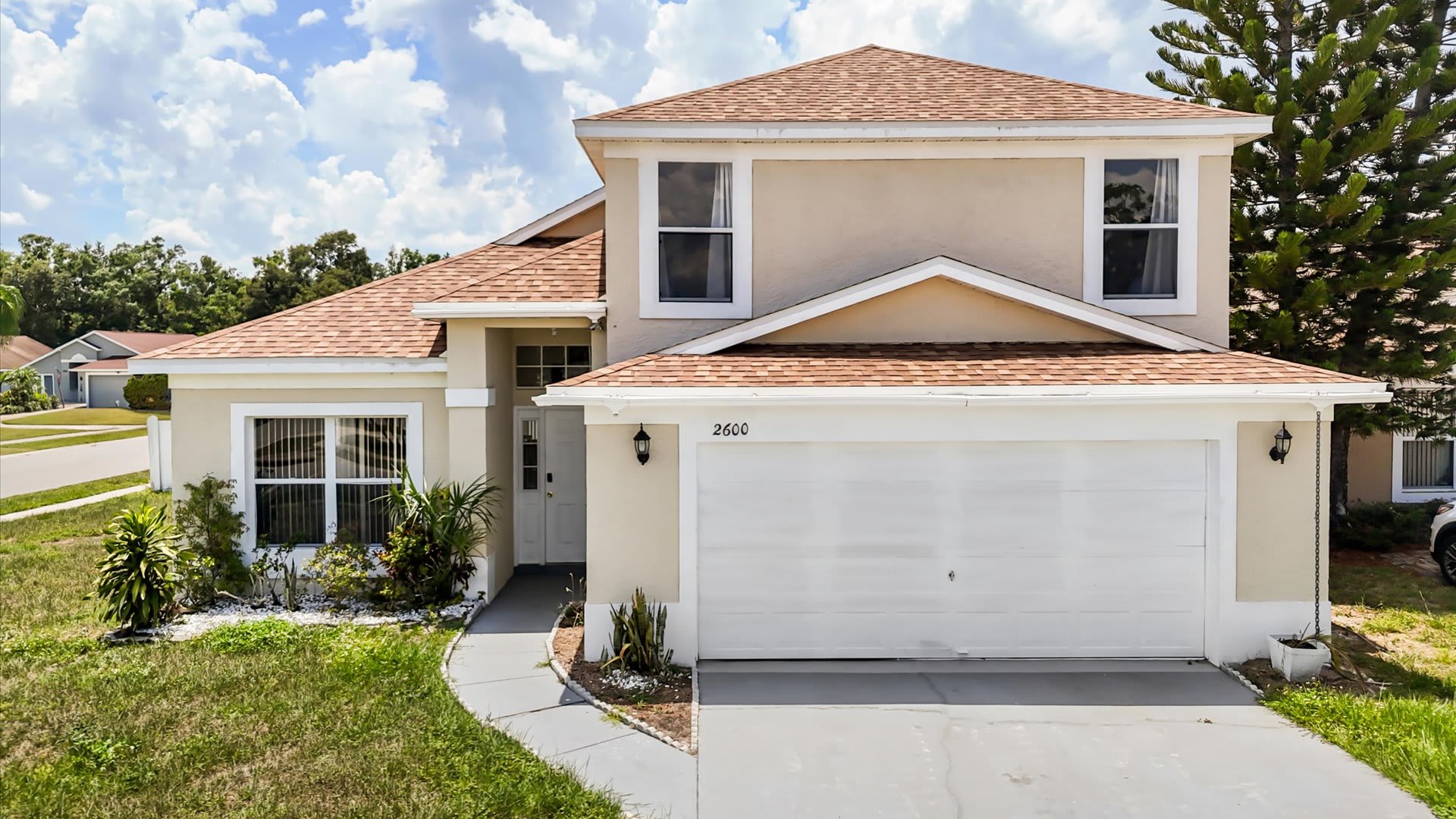 3BR Home exterior with driveway and parking 
