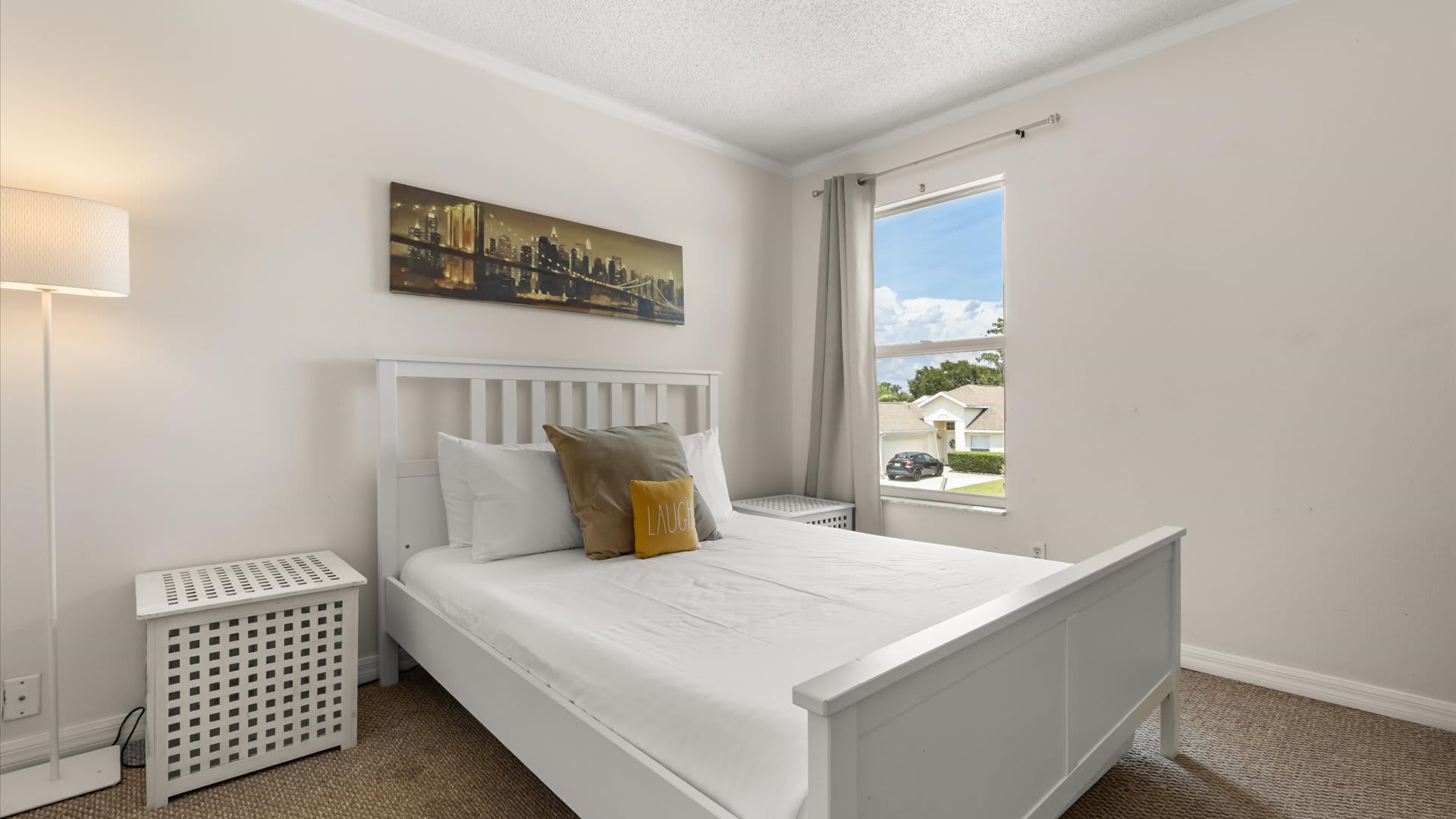 Queen Bedroom with natural light and smart TV