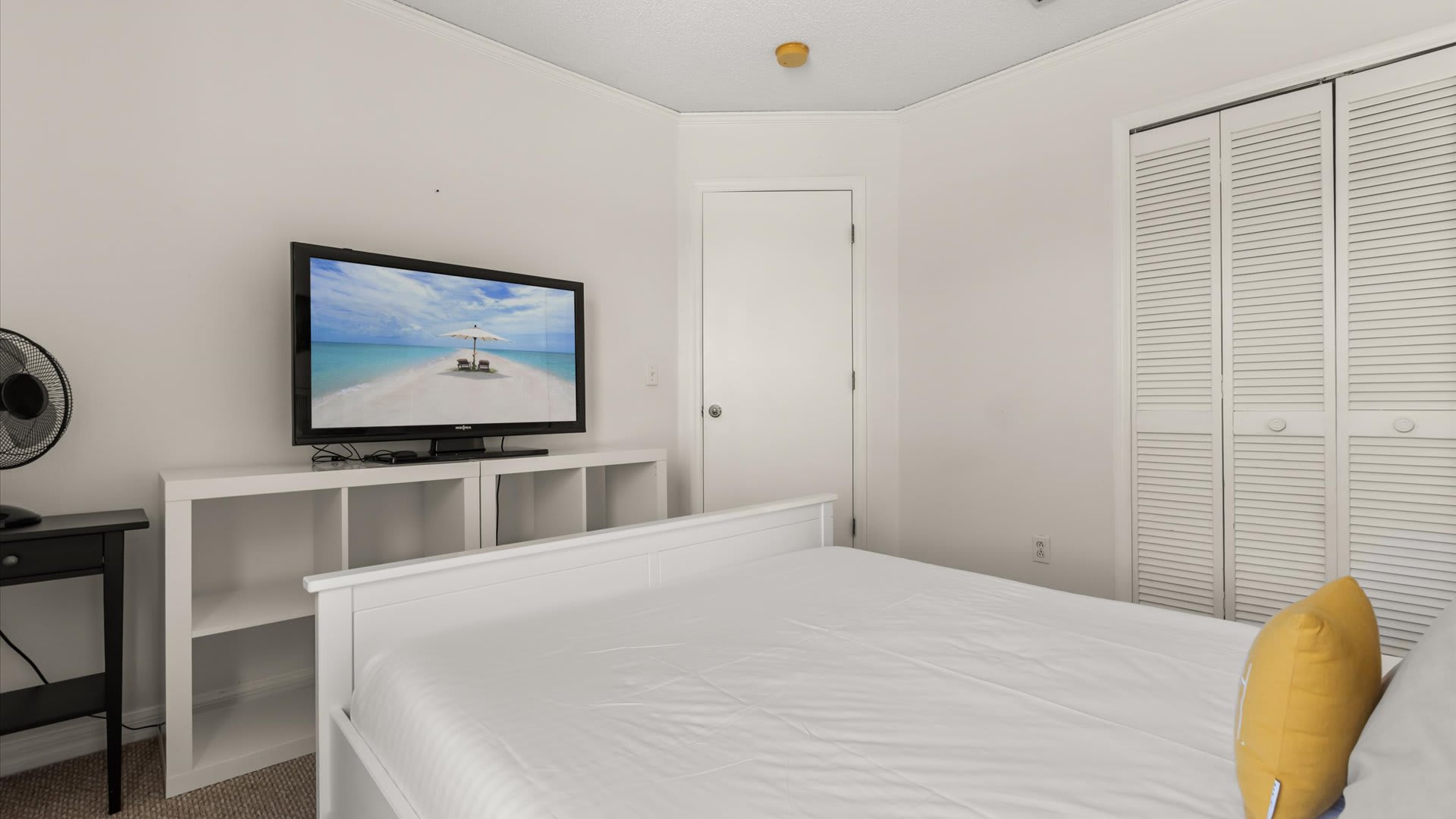 Queen Bedroom with natural light and smart TV