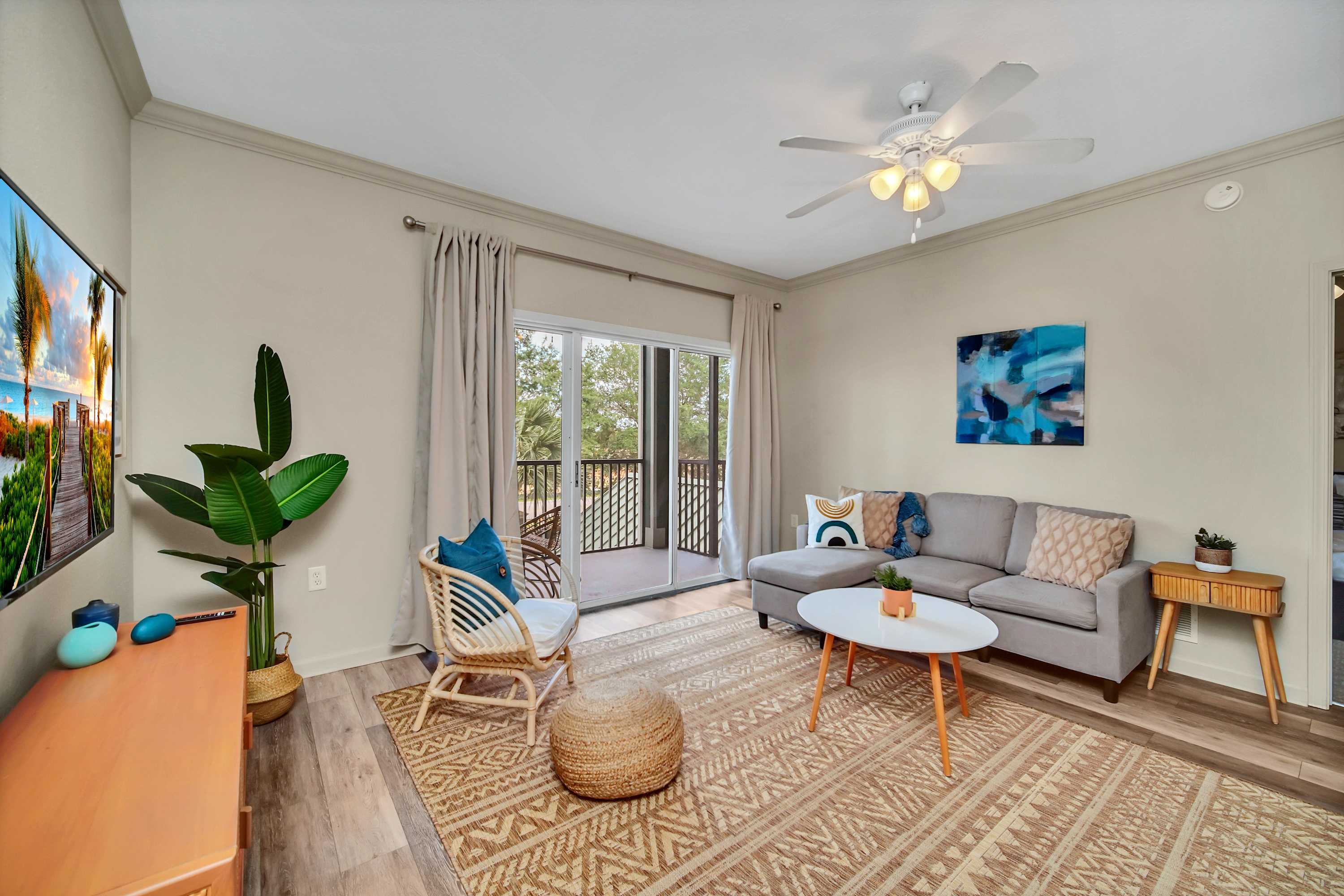 Modern living room with outdoor patio access and smart TV
