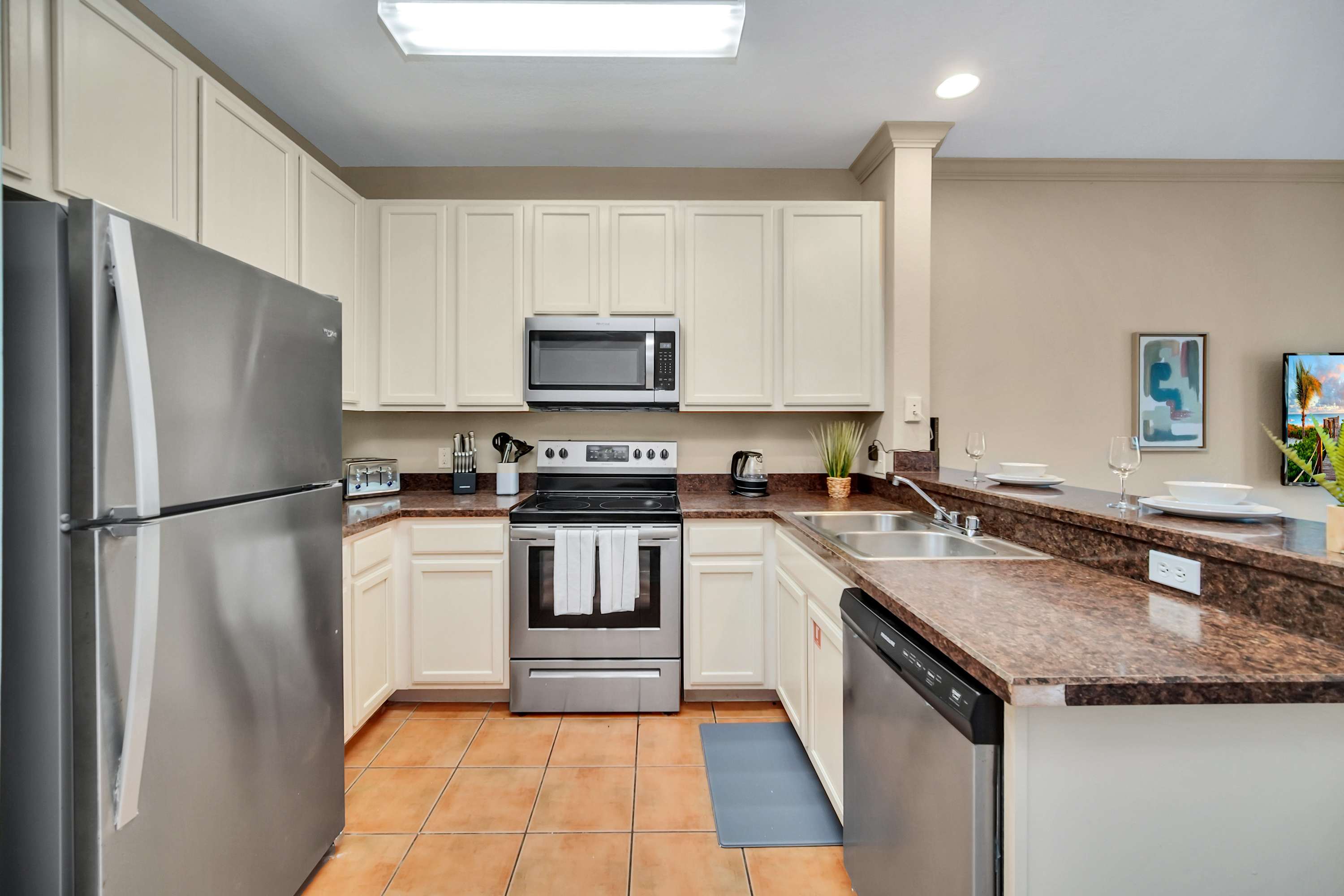 Fully equipped kitchen with silver appliances