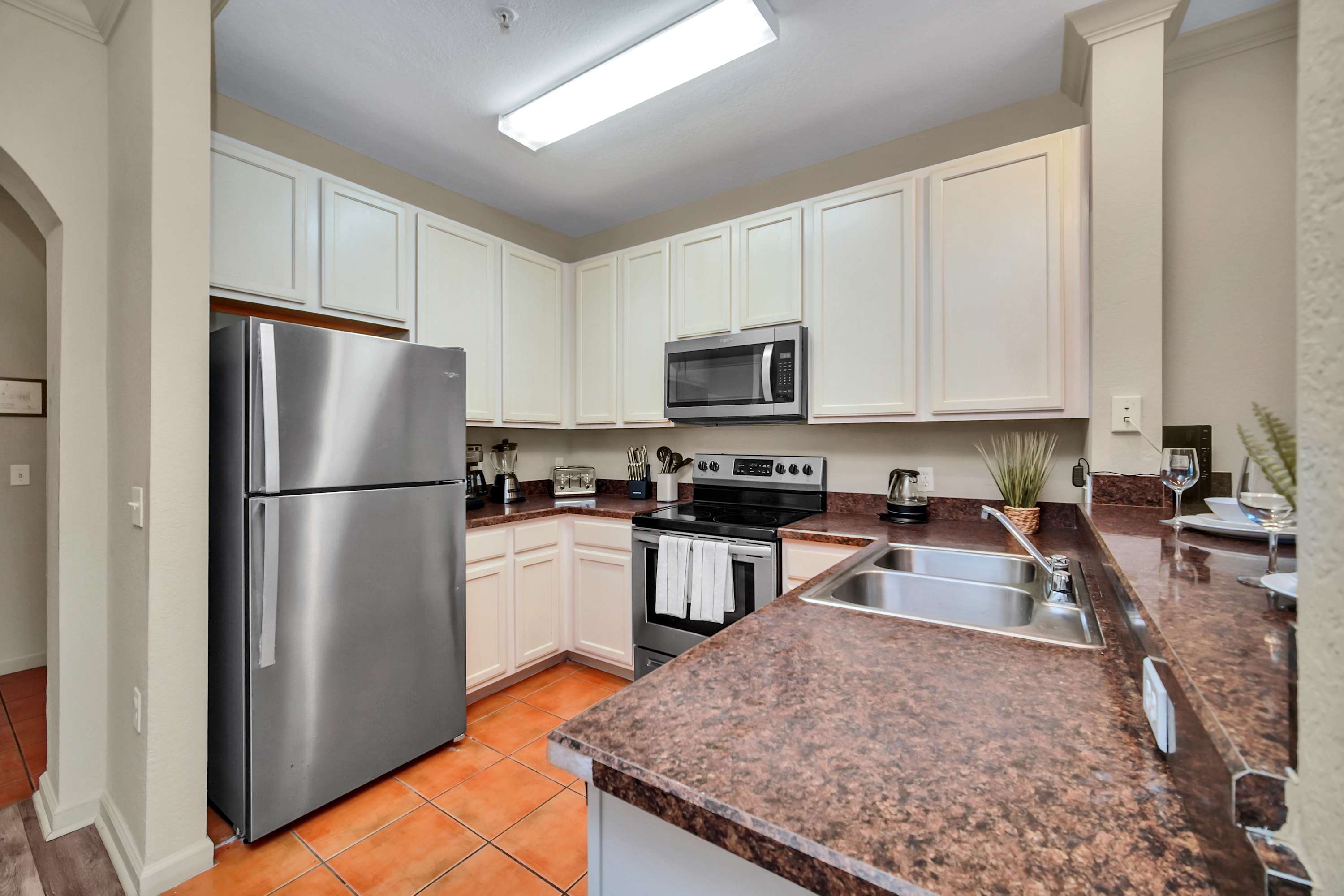 Fully equipped kitchen with silver appliances