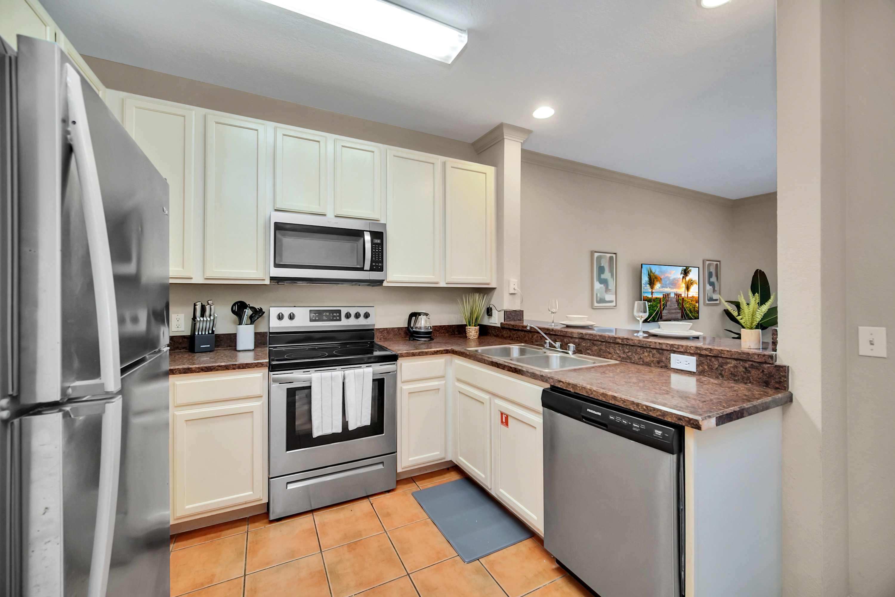 Fully equipped kitchen with silver appliances