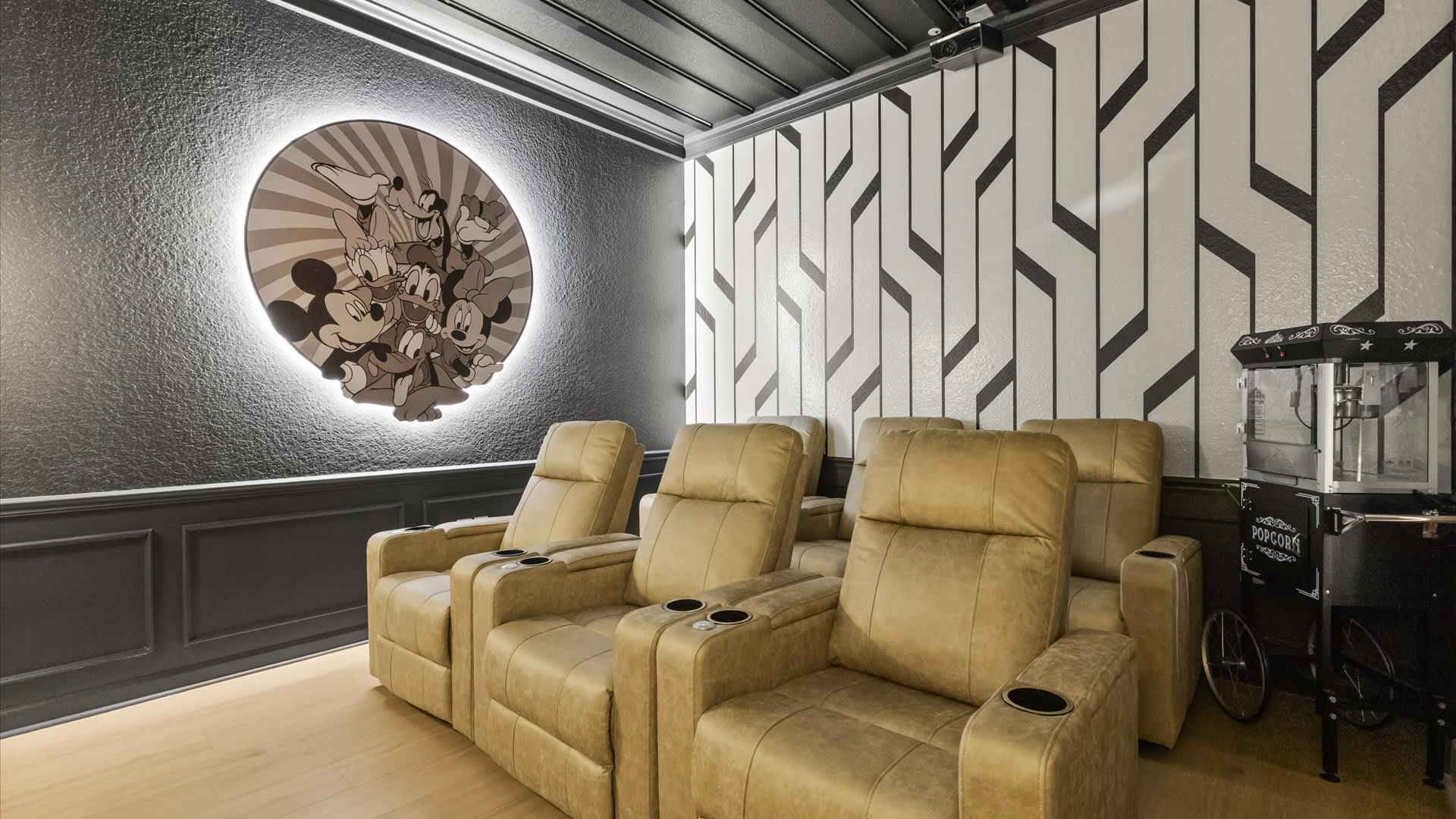 Newly renovated mickey-mouse themed in-home movie theater