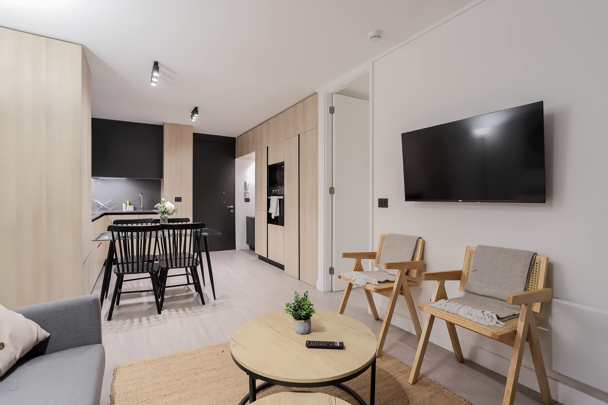 Chic open-plan living space with sleek design, perfect for relaxing and entertaining in style.