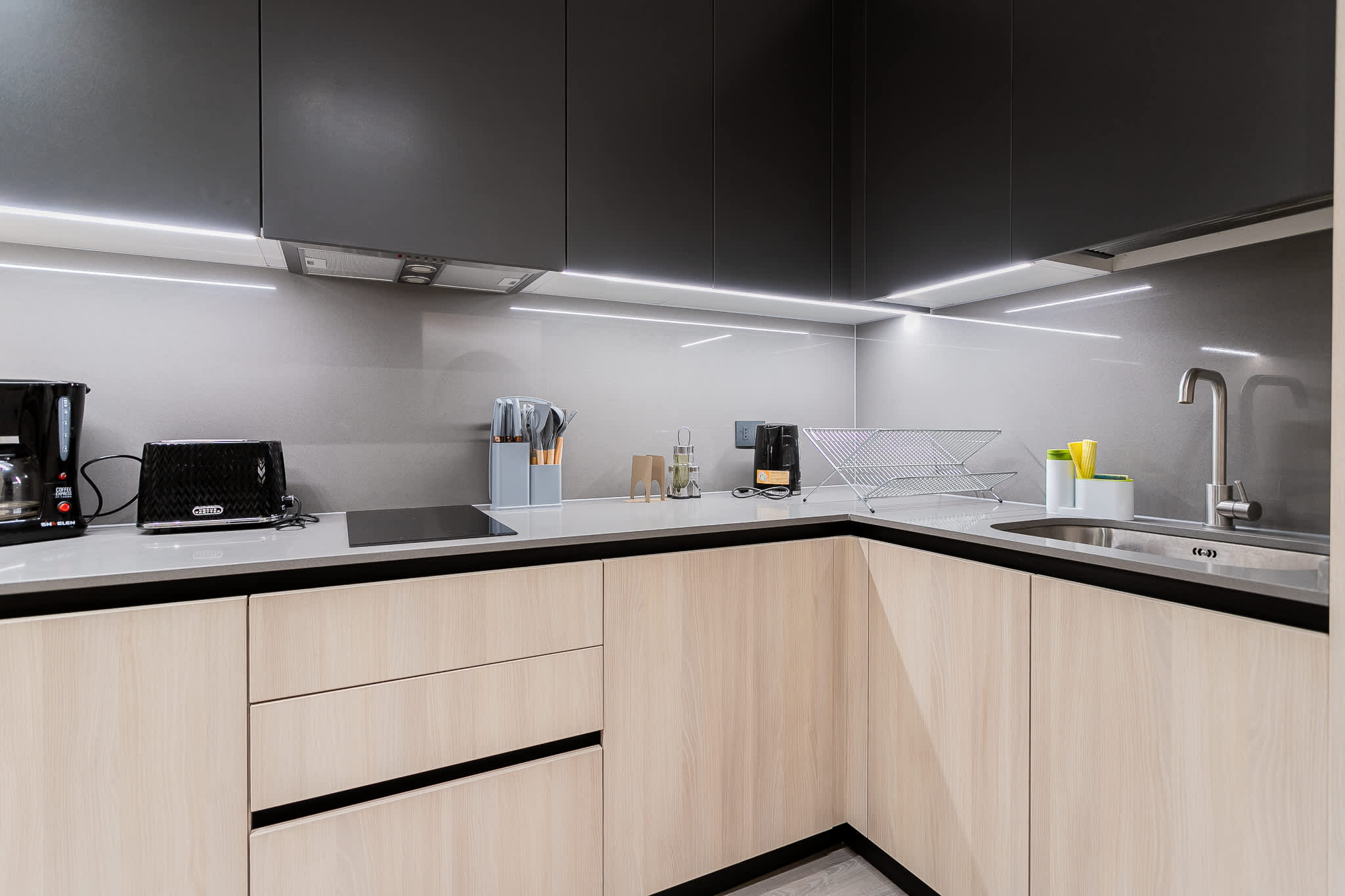 Sleek and modern kitchen with top-notch appliances and ample counter space for your culinary adventures.