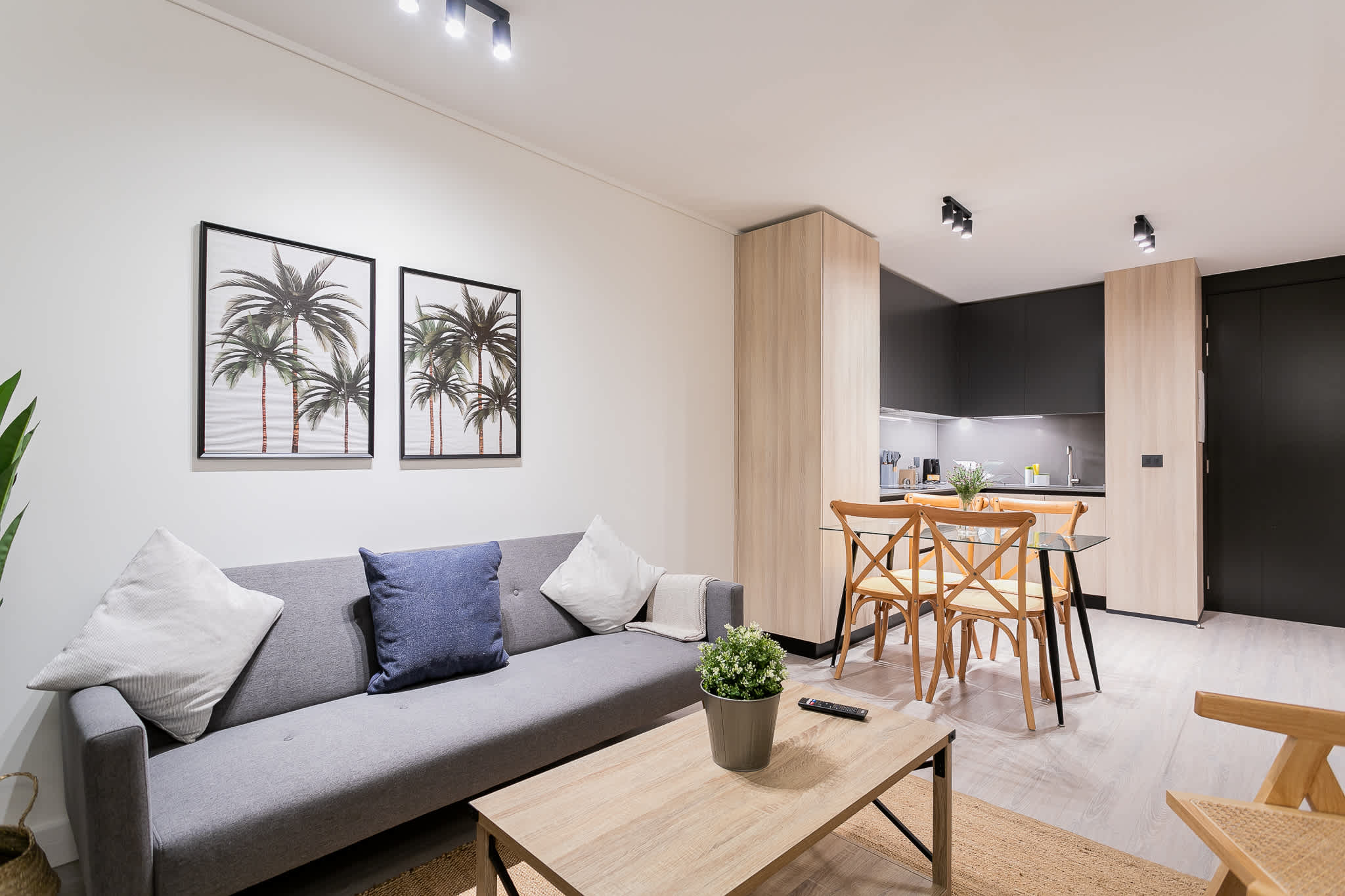 Modern living space with cozy seating, stylish dining area, and a sleek kitchen—perfect for a relaxing stay.