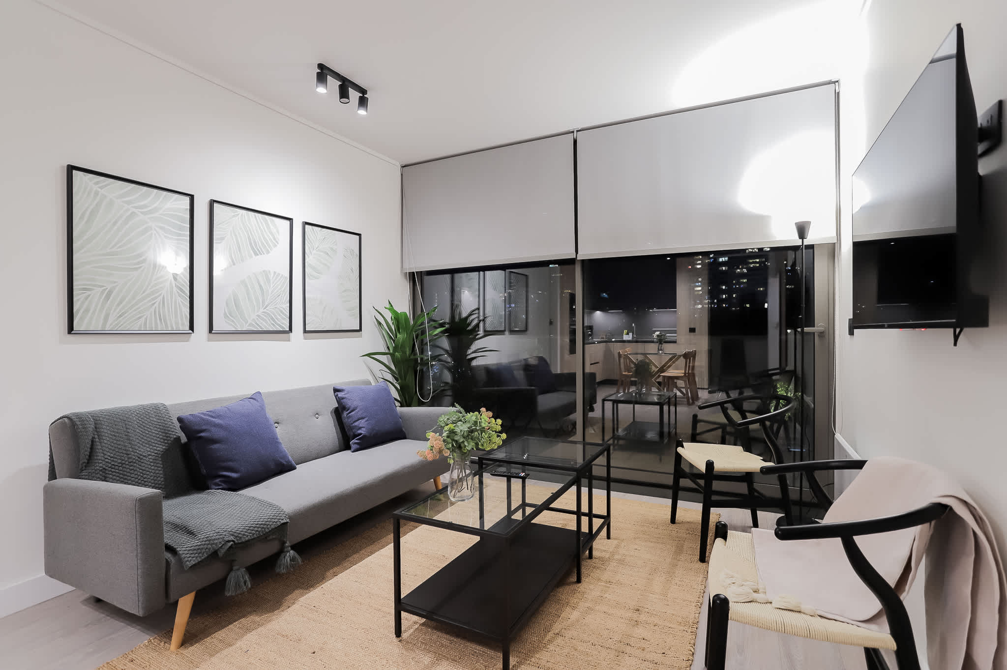 Chic urban living room with stunning city views, perfect for relaxation and entertainment.