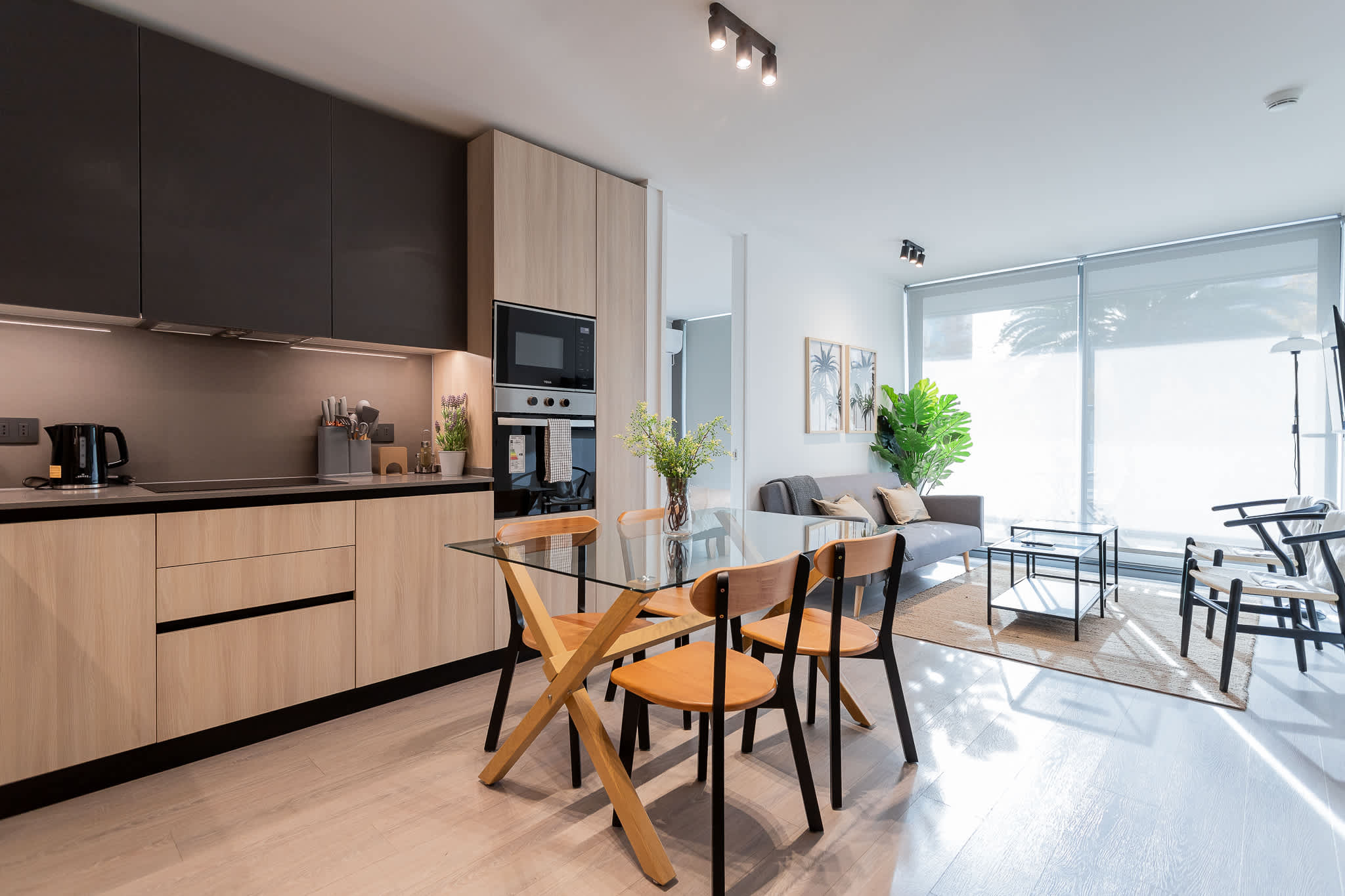 Experience modern living in this stylish kitchen and dining area, perfect for family meals and gatherings.