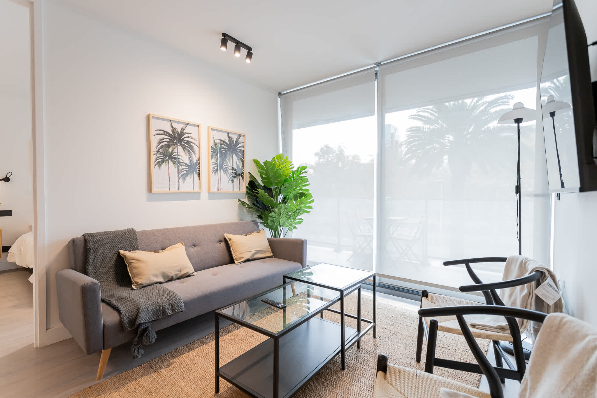 Bright and modern living space with stylish decor and a view of the outdoors, perfect for relaxation during your stay.