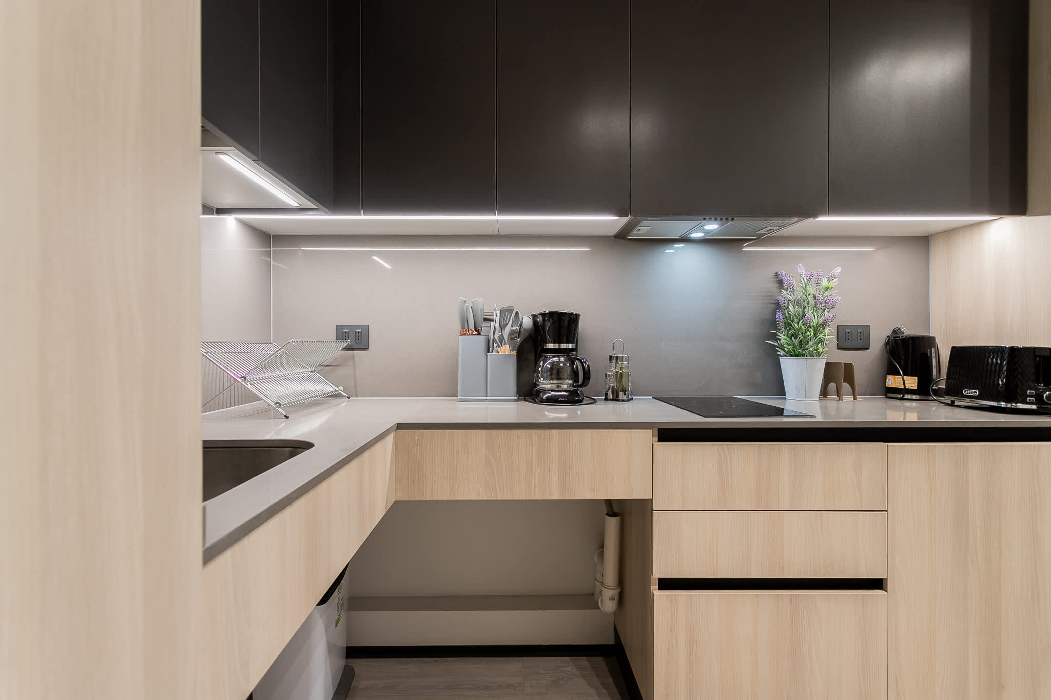 Sleek and modern kitchen with all essentials, perfect for culinary adventures during your stay.