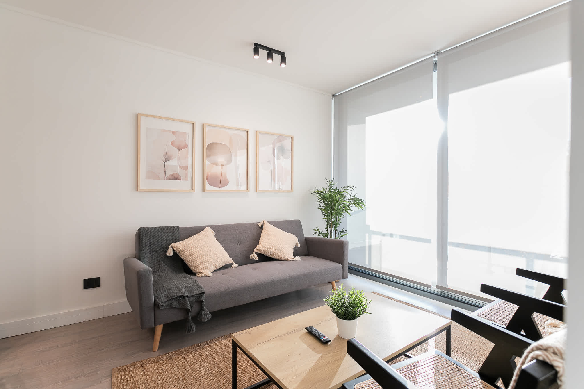 Relax in this stylish and sunlit living area, perfect for unwinding after a day exploring the city.
